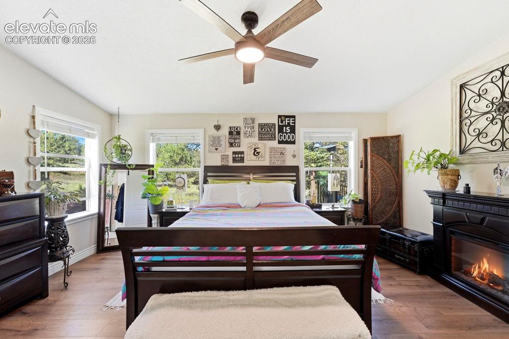 Recessed lighting, wood-finish flooring, and multiple windows
