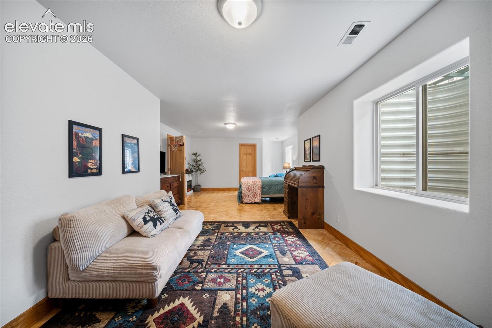 Basement bedroom with a sitting area