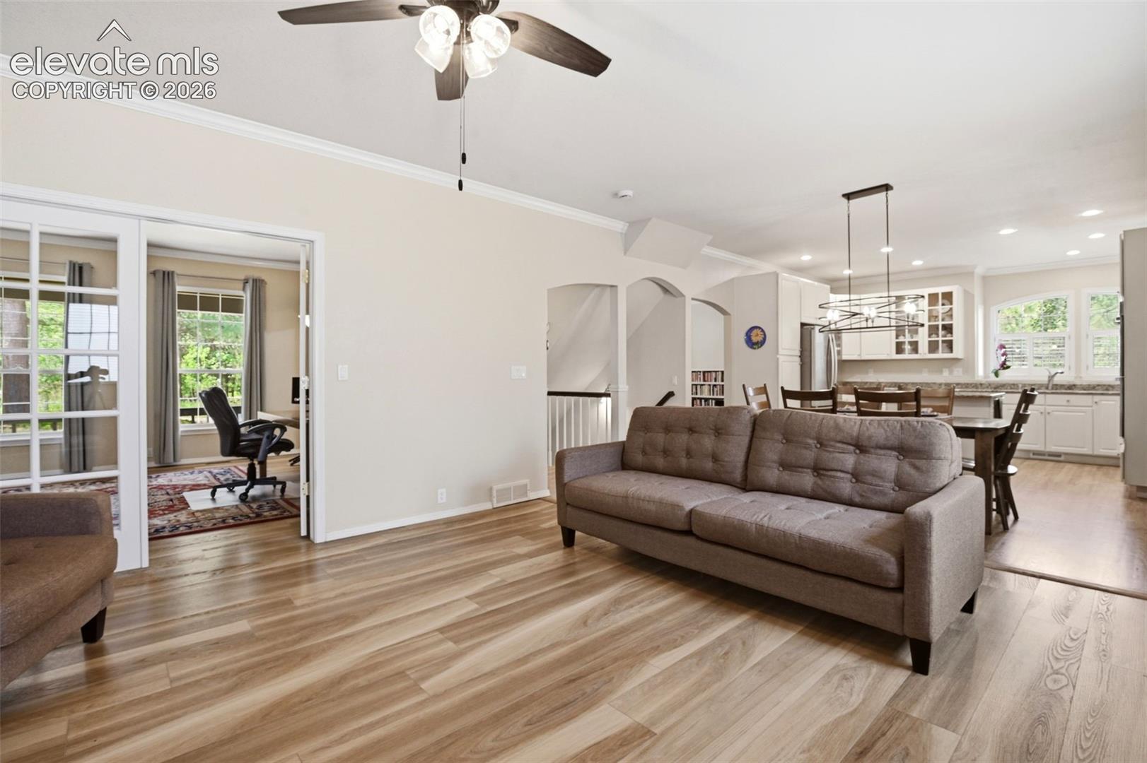 Great room leads to the current office through french doors.