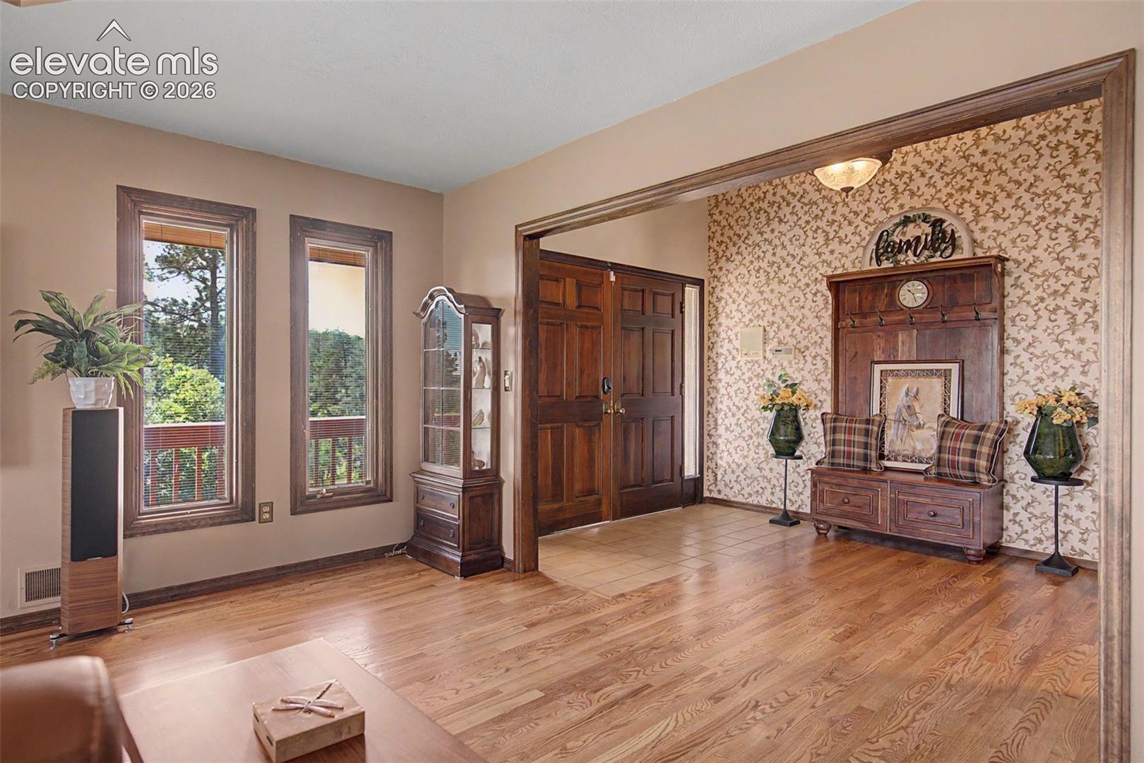 Open concept front entry welcome your guests inside with a modern luxurious flair. 