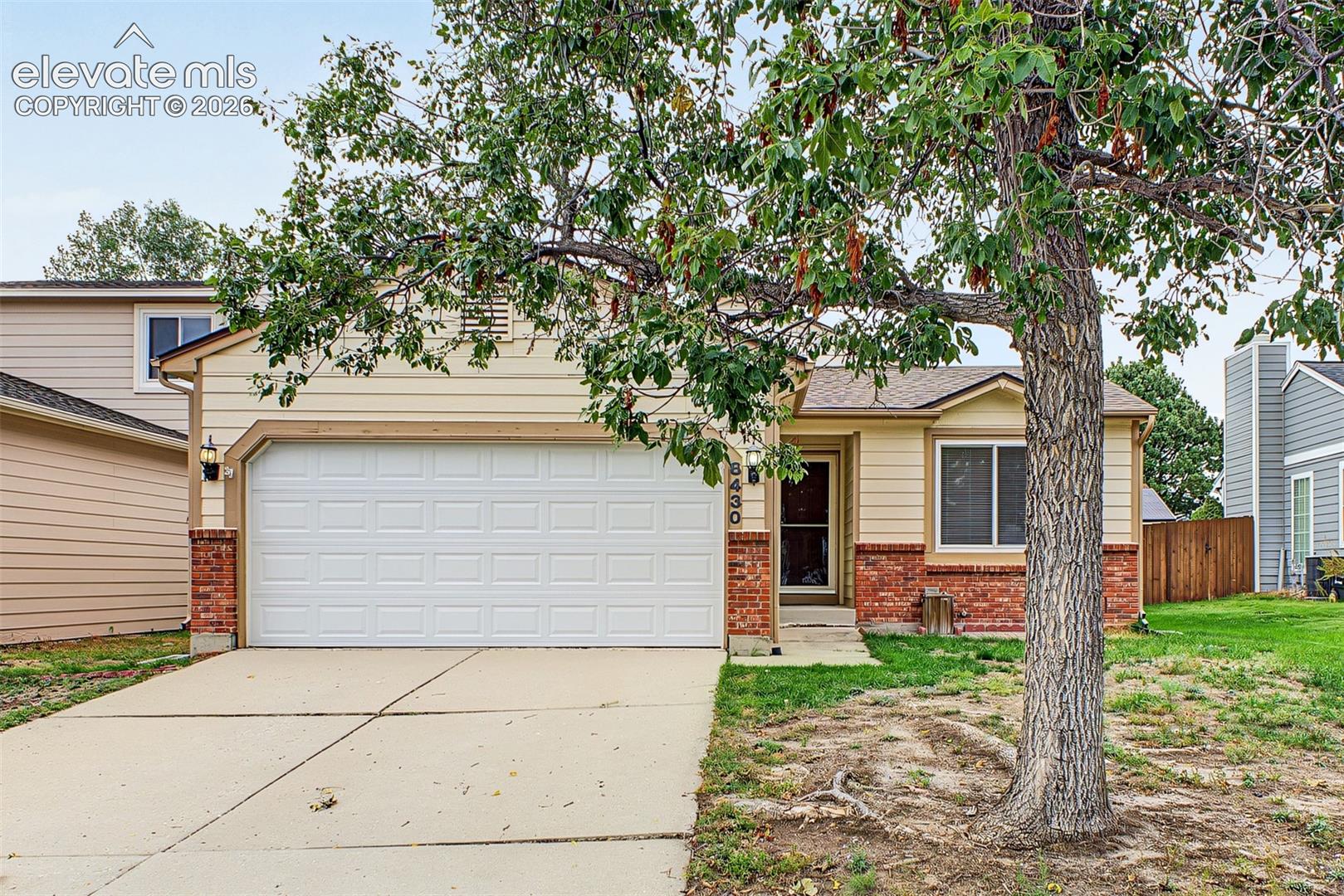 Welcome to this charming ranch-style home in the established Meadow Ridge at Briargate community— with no HOA and a 2-car garage! Step inside to a bright, open layout featuring vaulted ceilings, abundant natural light, a cozy fireplace, fresh interior paint, and brand-new flooring. The kitchen offers quartz countertops and easy access to a separate outdoor space that’s perfect for grilling or enjoying your morning coffee. The primary retreat includes a private bath with double sinks and a tub/shower combination. Downstairs, you’ll find a spacious additional bedroom with a walk-in closet that could also serve as a home office, guest suite, recreation room, or additional living space. The basement and crawl space provide plenty of extra storage. Outside, enjoy multiple areas for relaxing and entertaining, including a large concrete patio off the dining room and an additional outdoor space off the kitchen. The professionally installed artificial turf keeps the backyard green year-round while offering low-maintenance living and reduced water usage. Conveniently located in North Colorado Springs near shopping, dining, parks, schools, and everyday amenities, with easy access to major roadways for commuting throughout the city. Enjoy miles of neighborhood walking and biking trails and the highly sought-after Academy School District 20.
