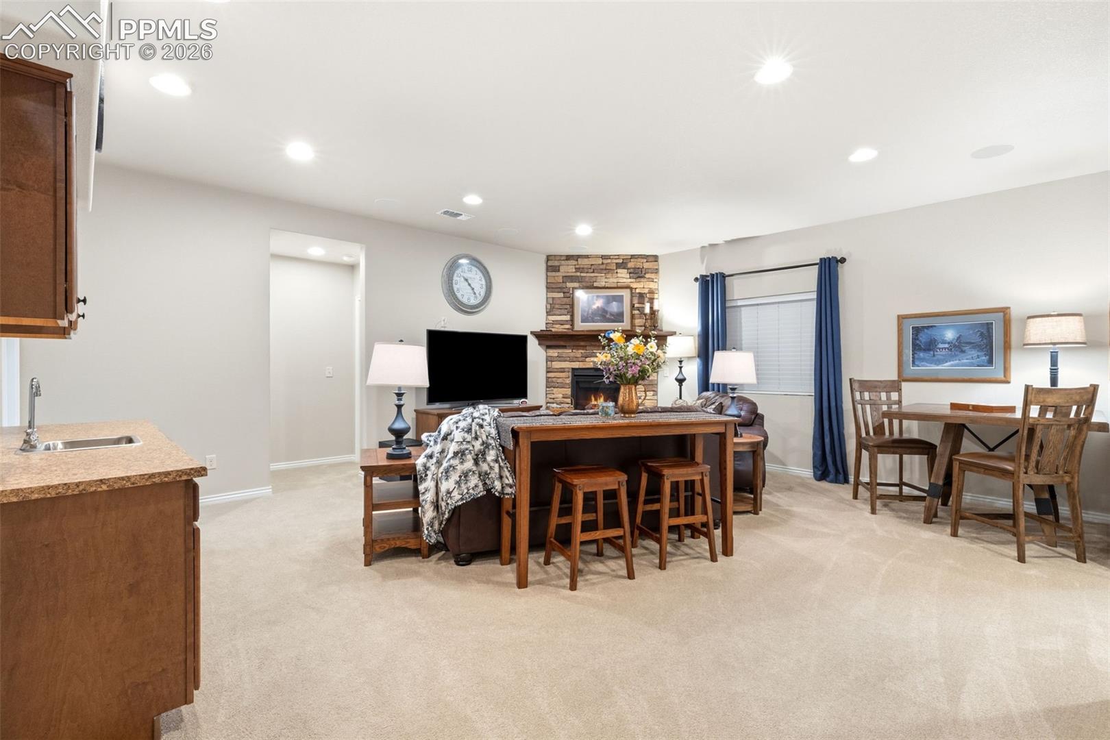 Lower level family room with wetbar and refrigerator