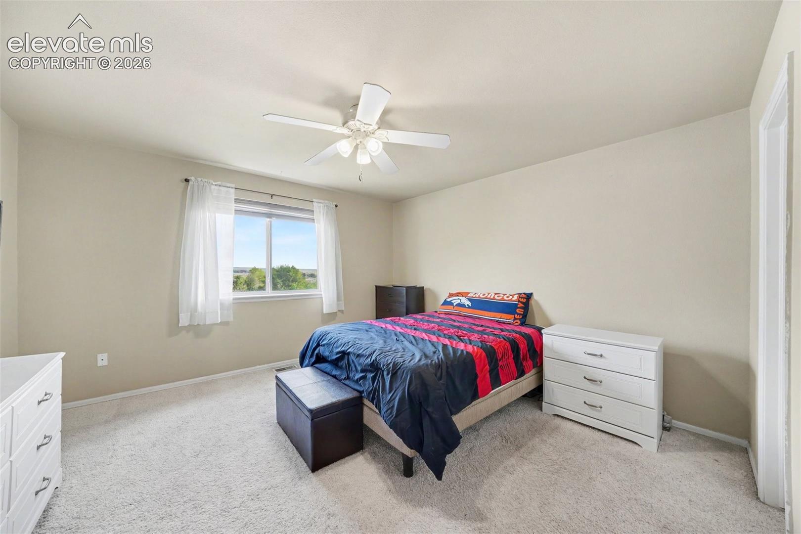 Primary Bedroom with ceiling fan with integrated lighting