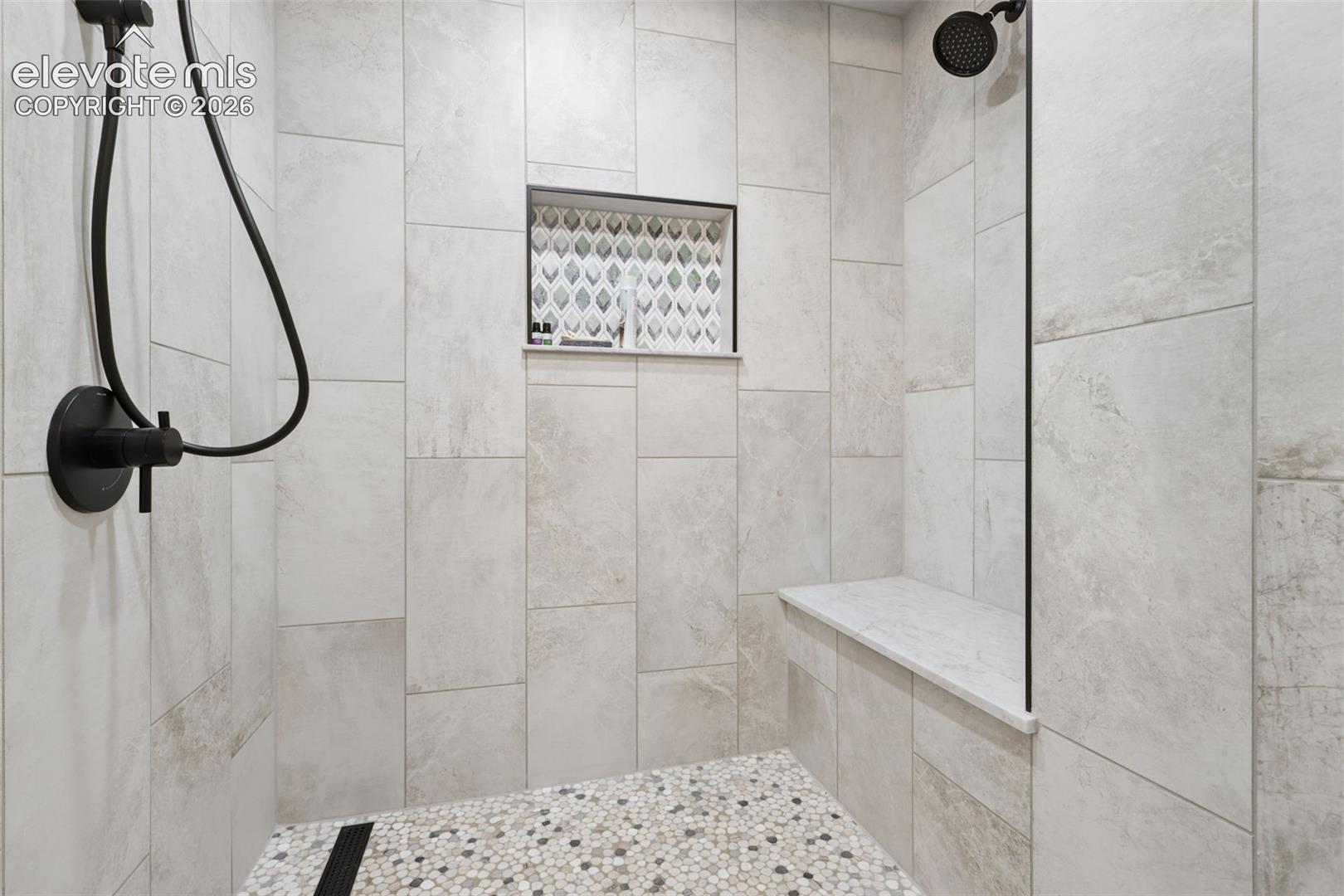 Relax and enjoy the walk-in, double head, steam shower room