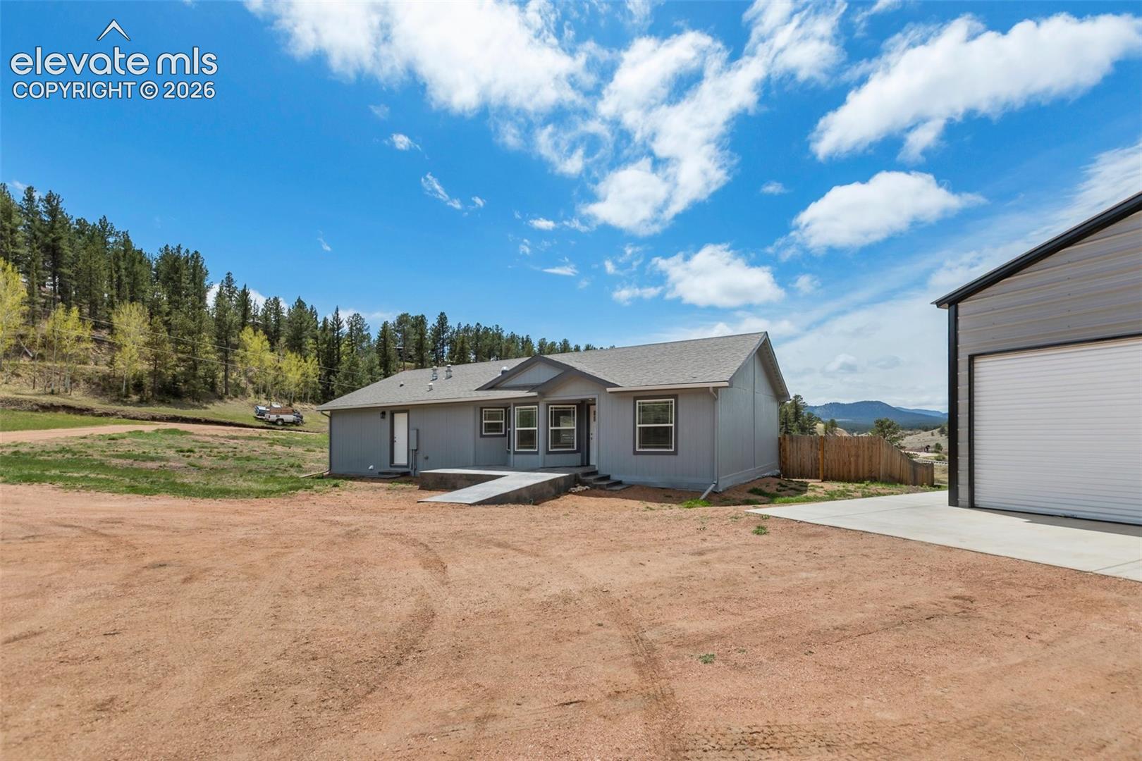 Front of property with garage