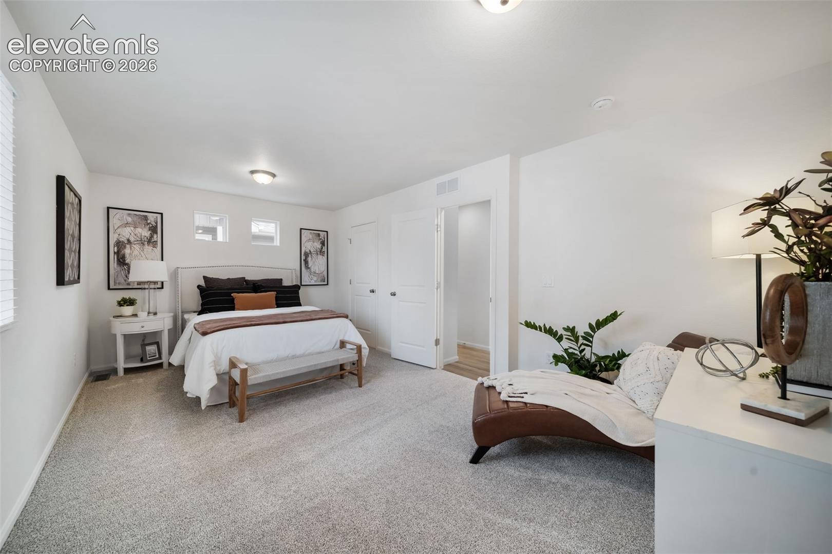 Recessed ceiling lighting, white walls, and light-colored carpeting
*photos of a model home*