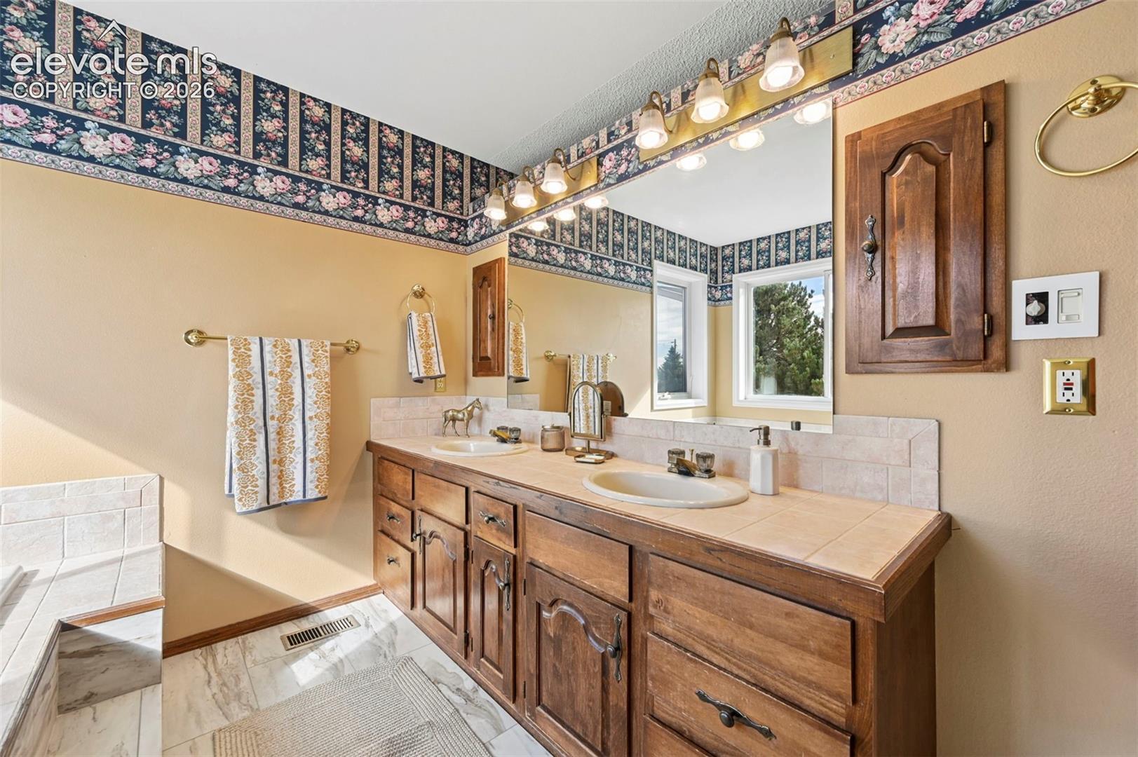 Dual vanity and a tile countertop
