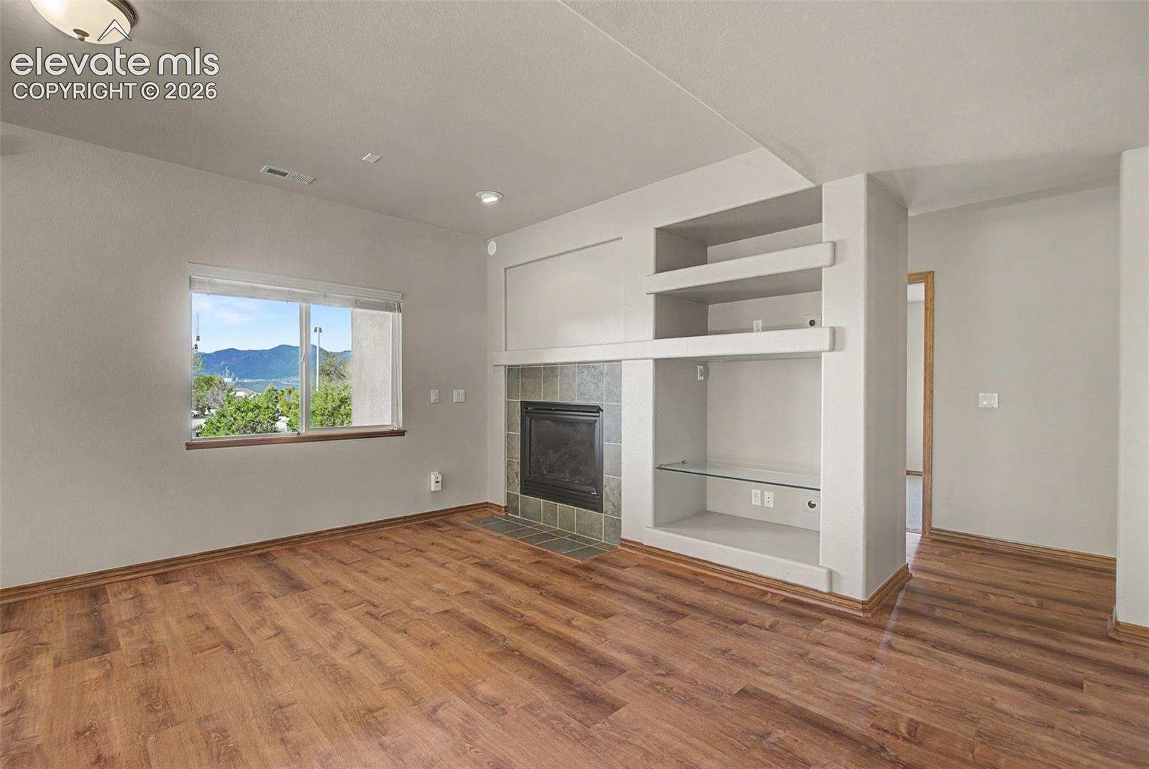 Large family room is basement with fireplace