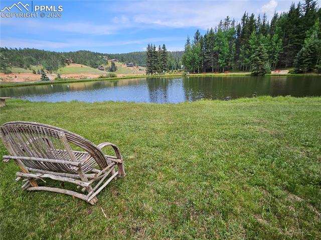 Bench Overlooking Community Pond.