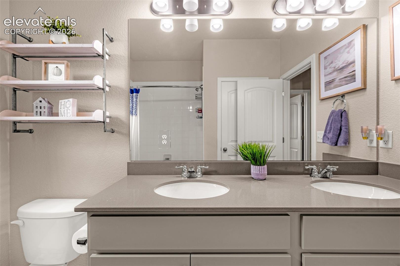 Dual vanity with undermount sinks and chrome fixtures