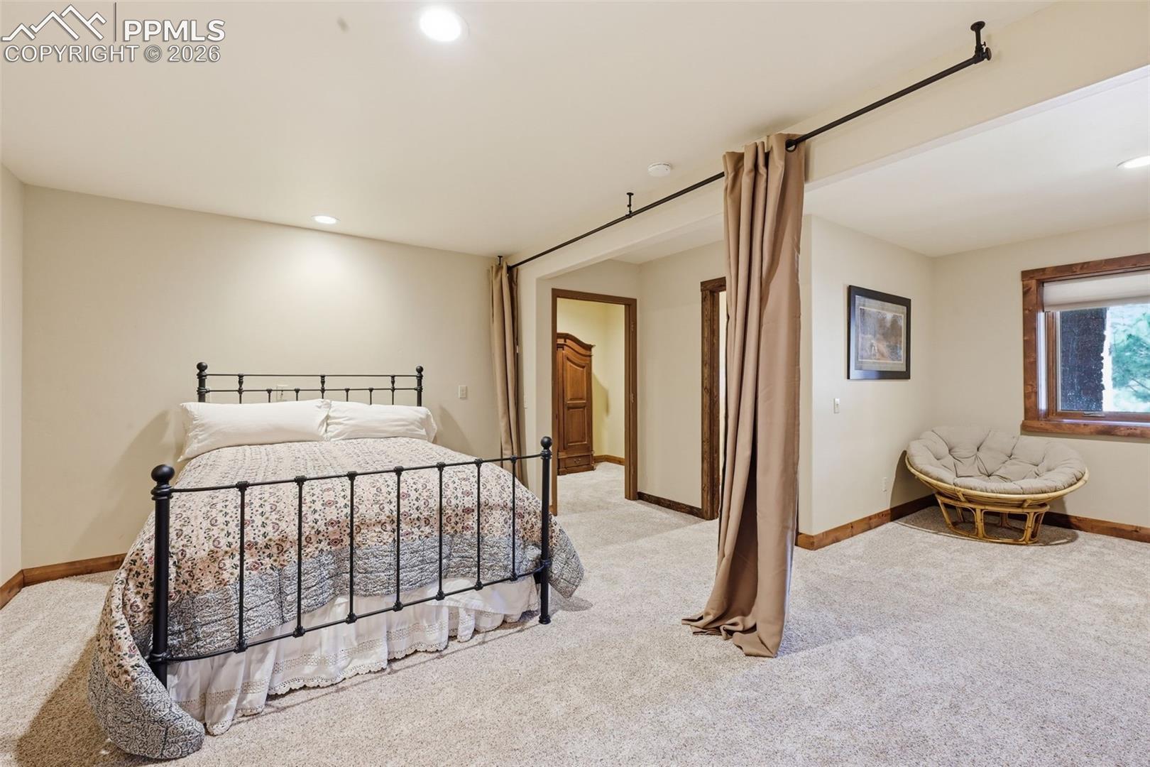 Hanging curtains offer guests privacy during their visit, but doesn't close off the room when this space is not in use. 