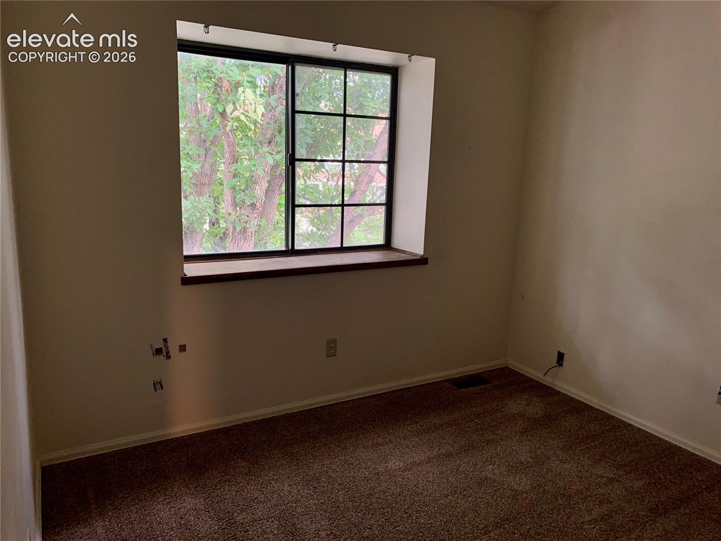 Window with dark framing and a wide sill