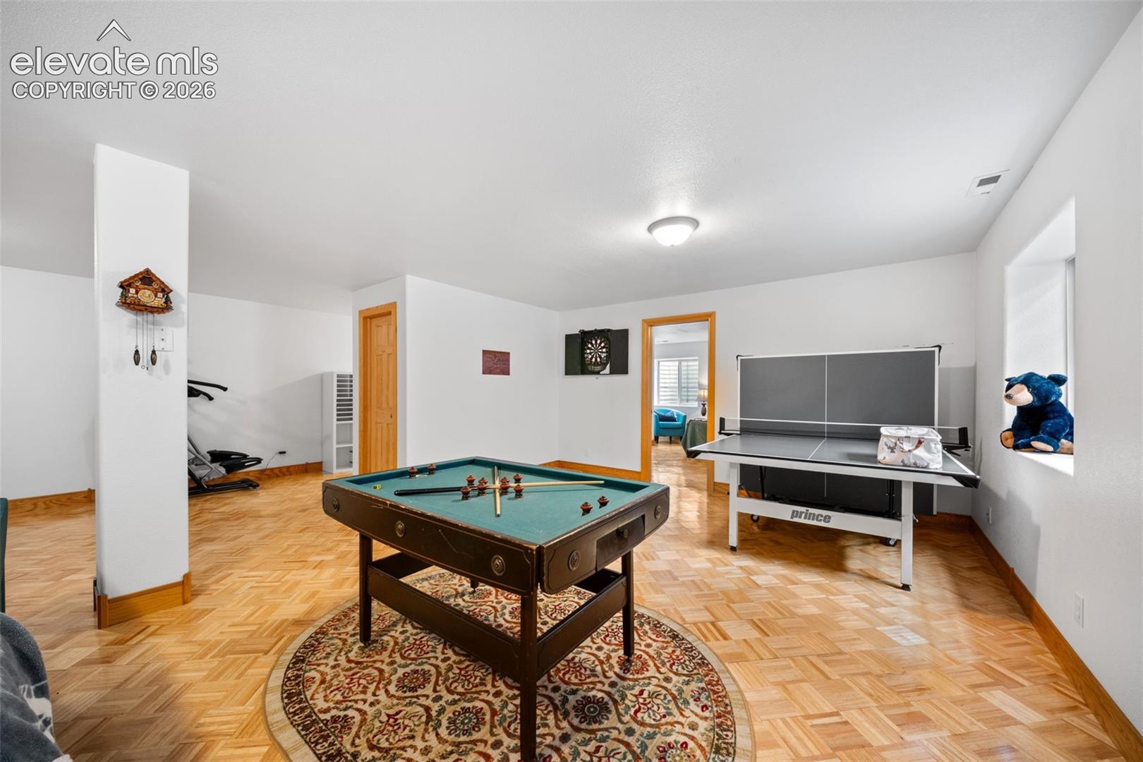 Basement family room being utilized as a game room 