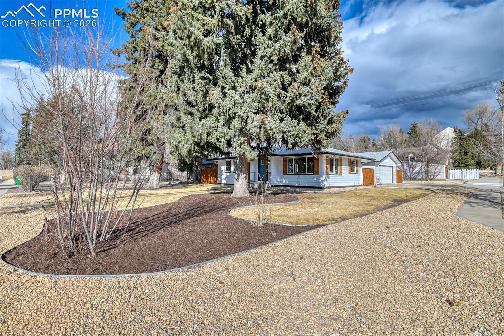 Ranch-style home featuring driveway