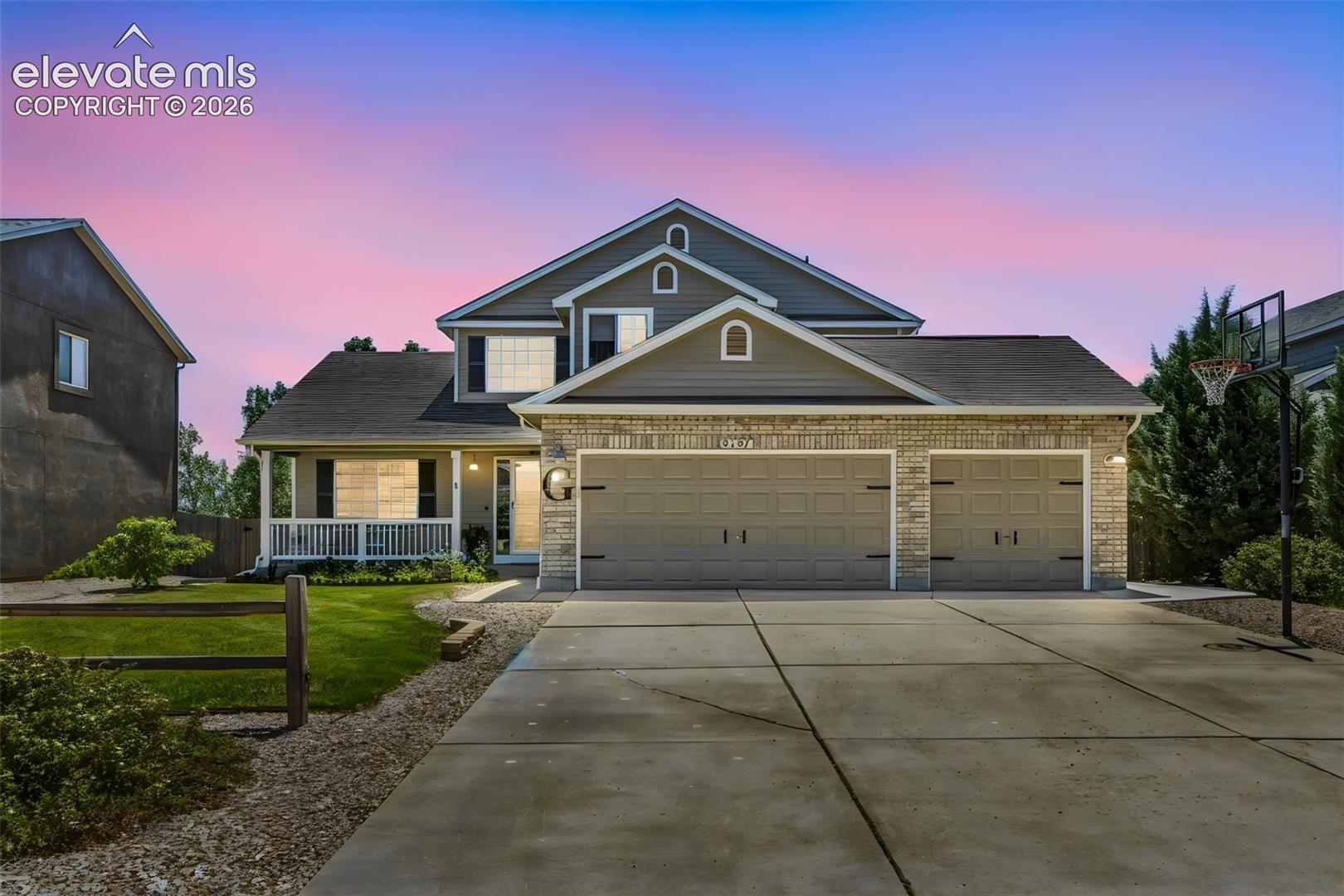 Welcoming Two-Story Home with Covered Front Porch & 3-Car Garage