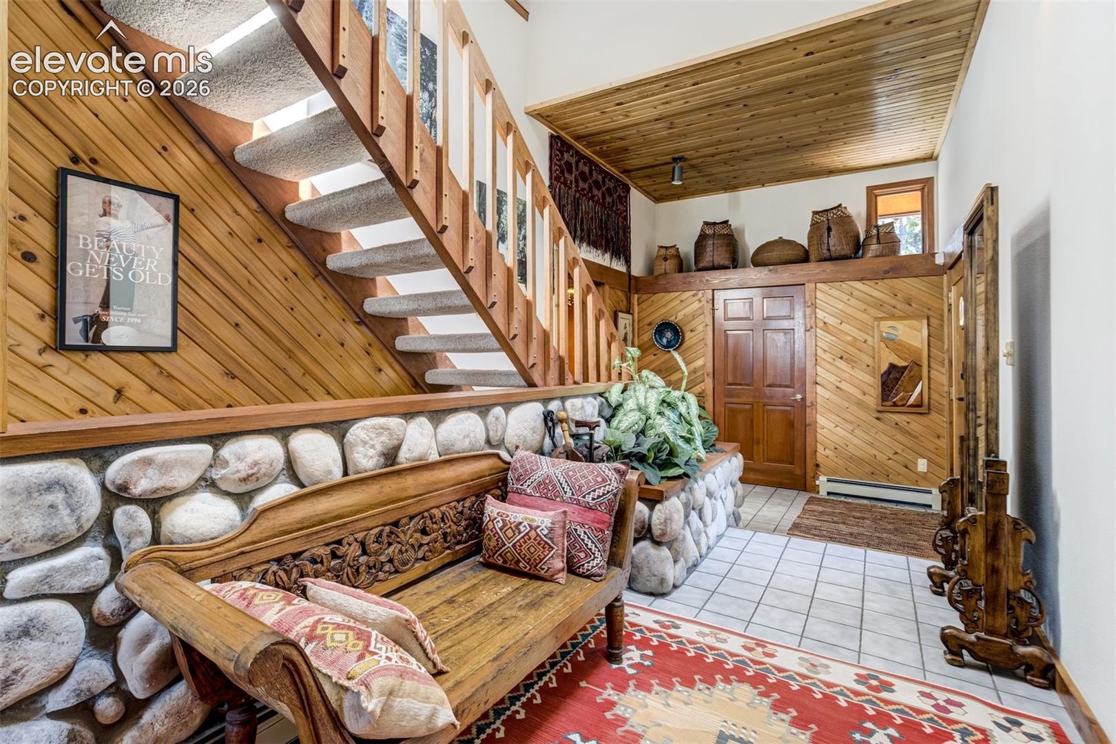 Walk in to natural light and high ceilings. Coat closet and upper decorative shelf with lighting