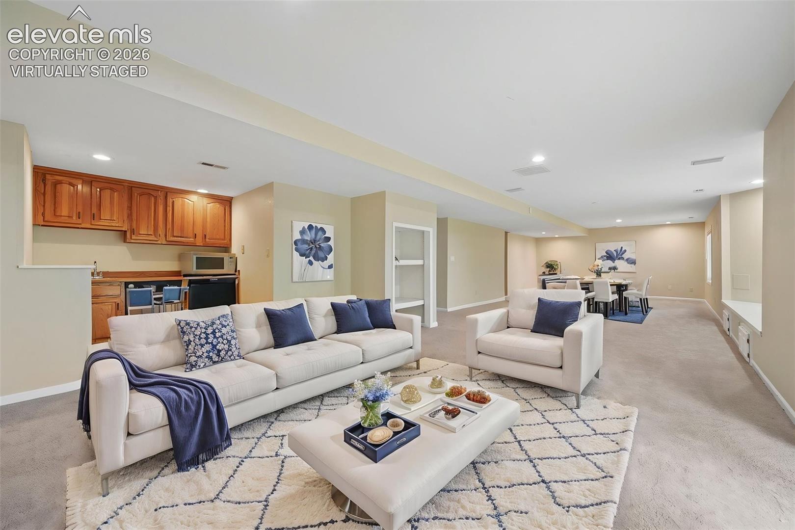 Virtually staged basement family room with brick fireplace and wetbar, walkout to lower deck!   