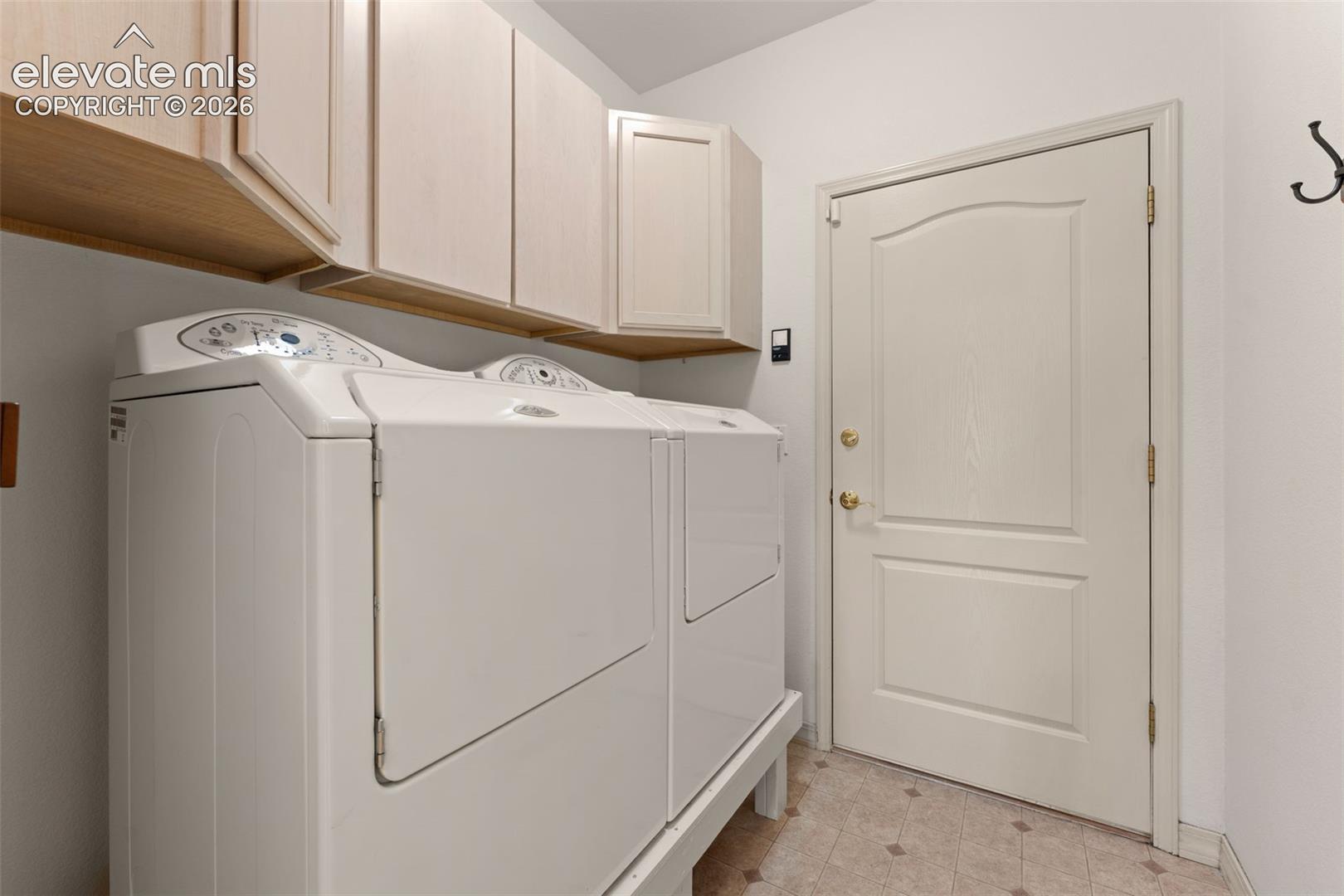 Plenty of cabinet space in laundry room