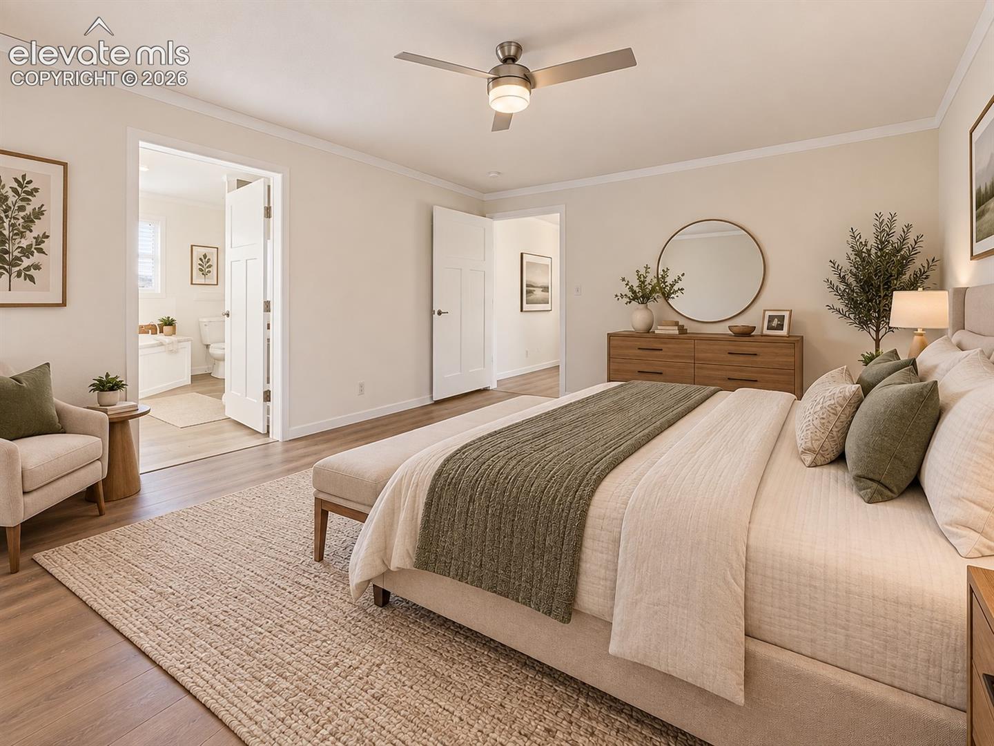 Primary Bedroom – Alternate primary-bedroom view highlights the spacious layout and direct access to the adjoining primary bathroom.