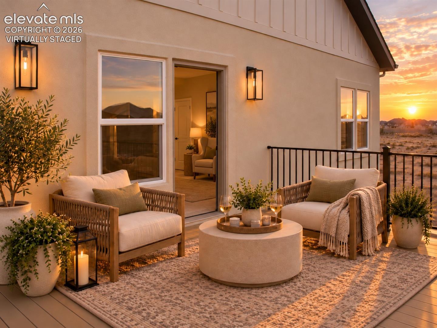 Virtually staged Outdoor deck with wrought iron railing and sconce lighting
