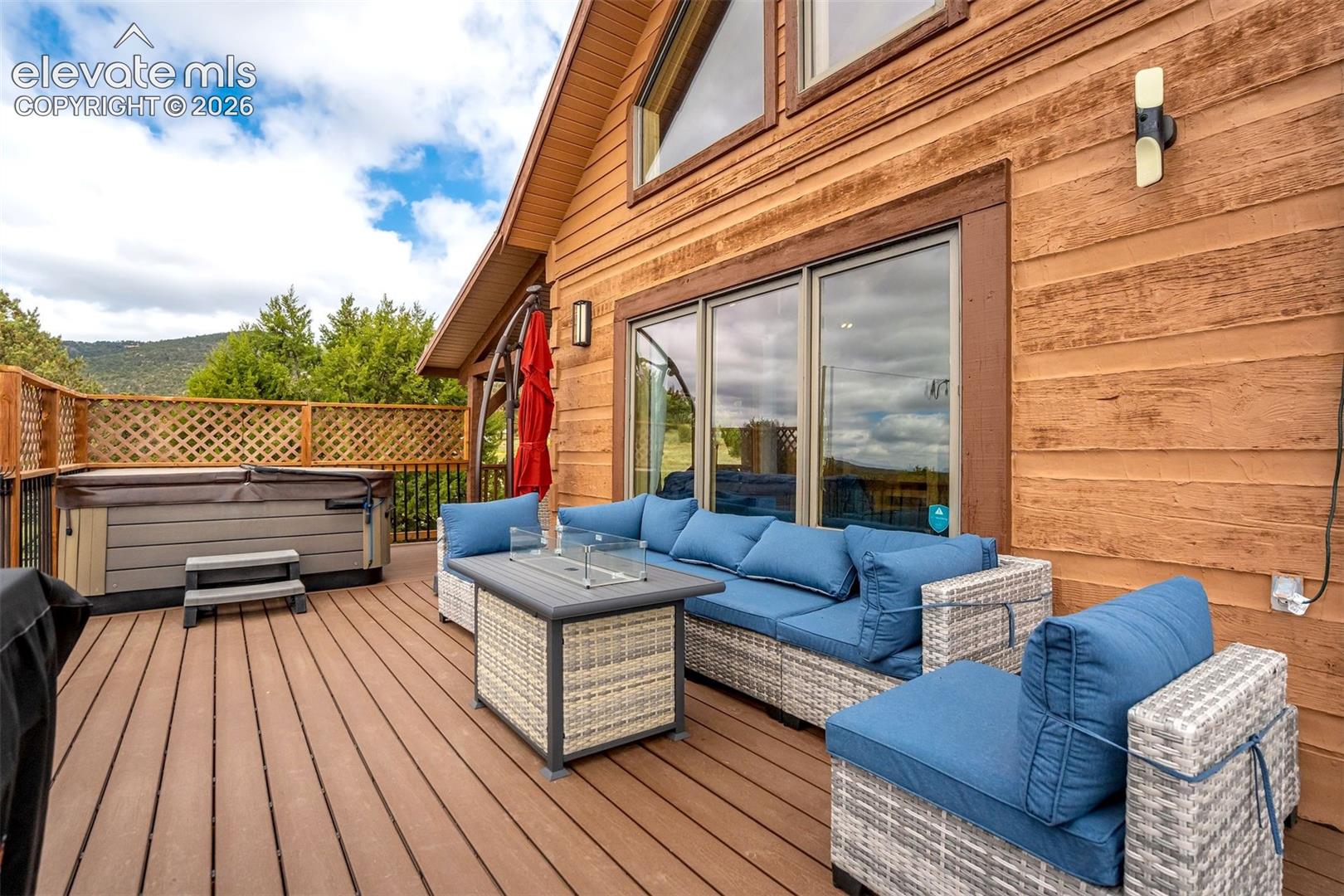 Spacious outdoor deck featuring wood-finish flooring