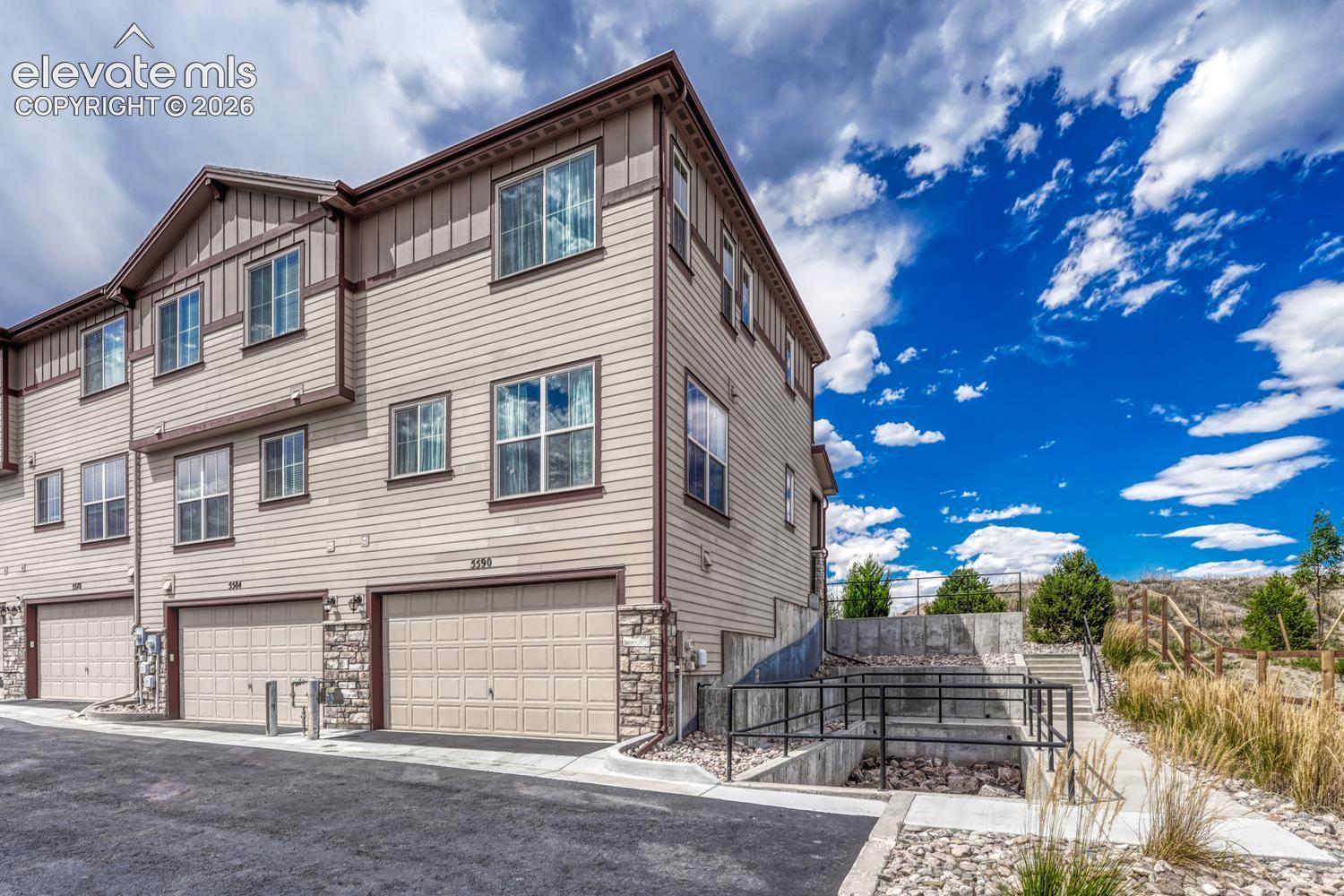 This end unit townhome provides an oversized 2-car tandem garage with a SMART Wi-Fi garage door opener.
