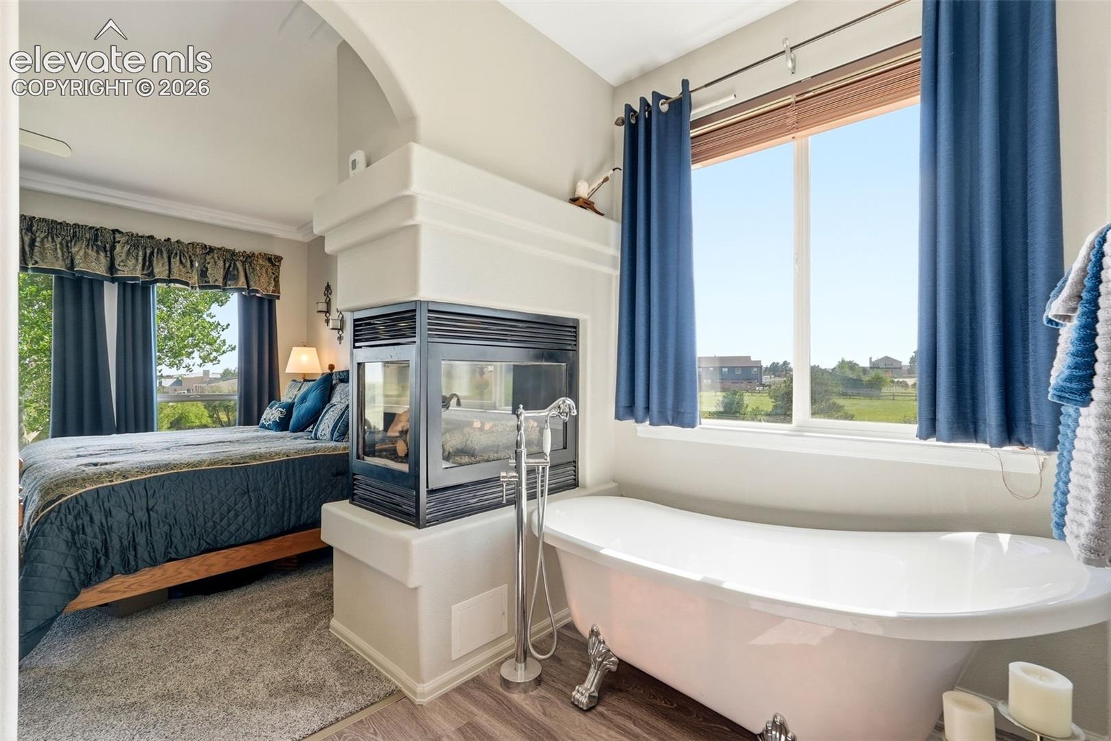 3 sided fireplace next to your clawfoot tub