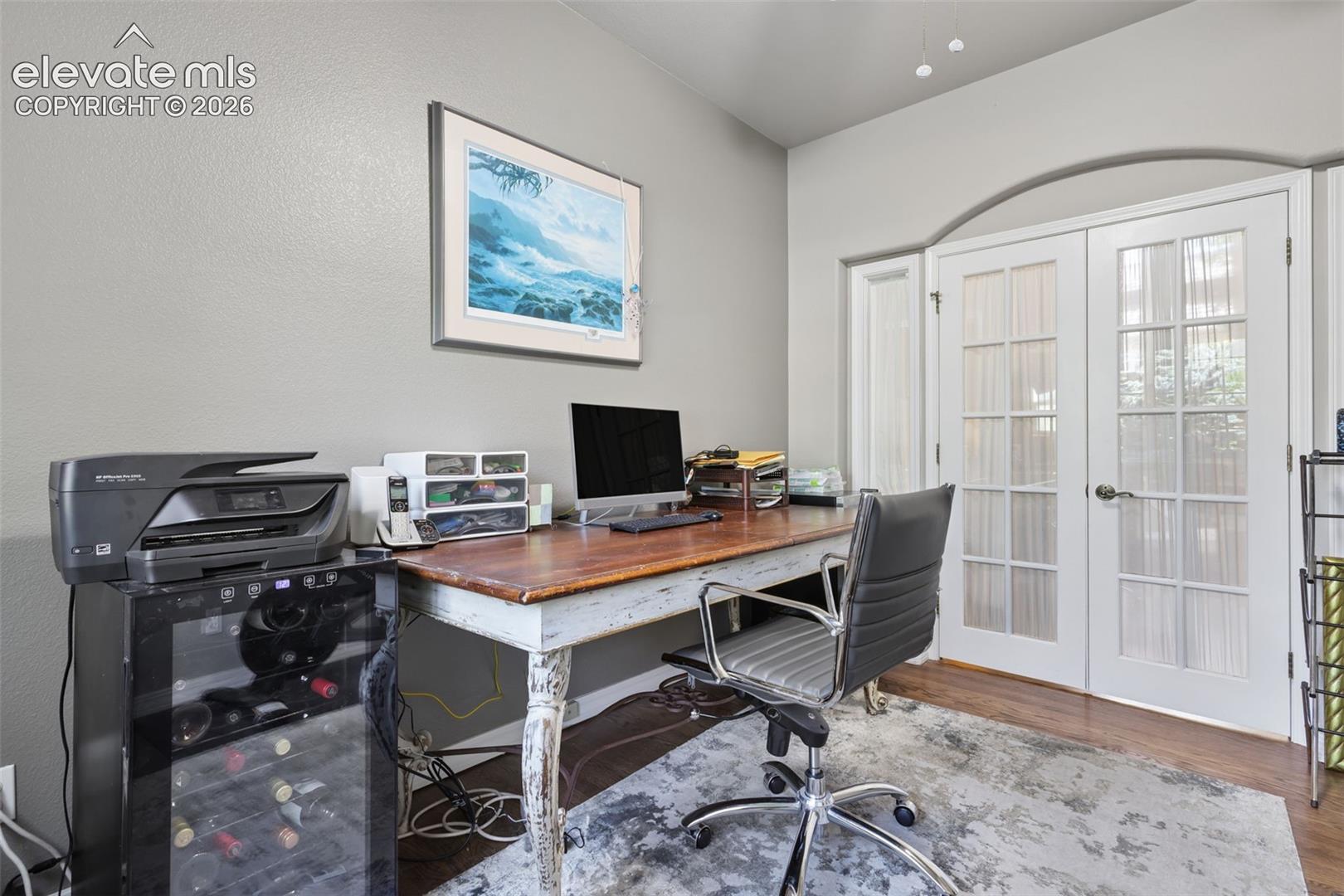 Main level office has closet and french doors.