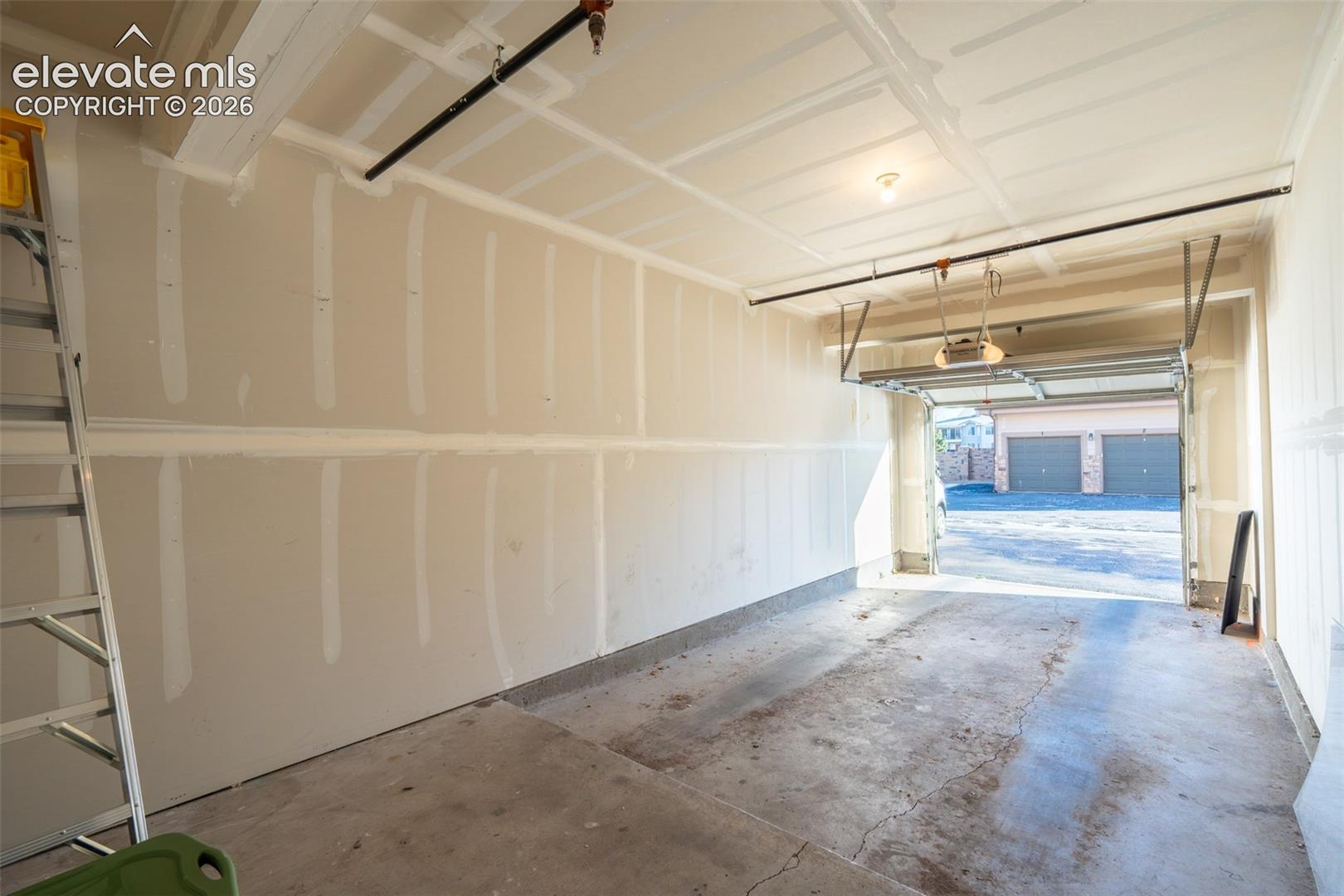 Oversized and attached garage (number 6) and reserved space in front