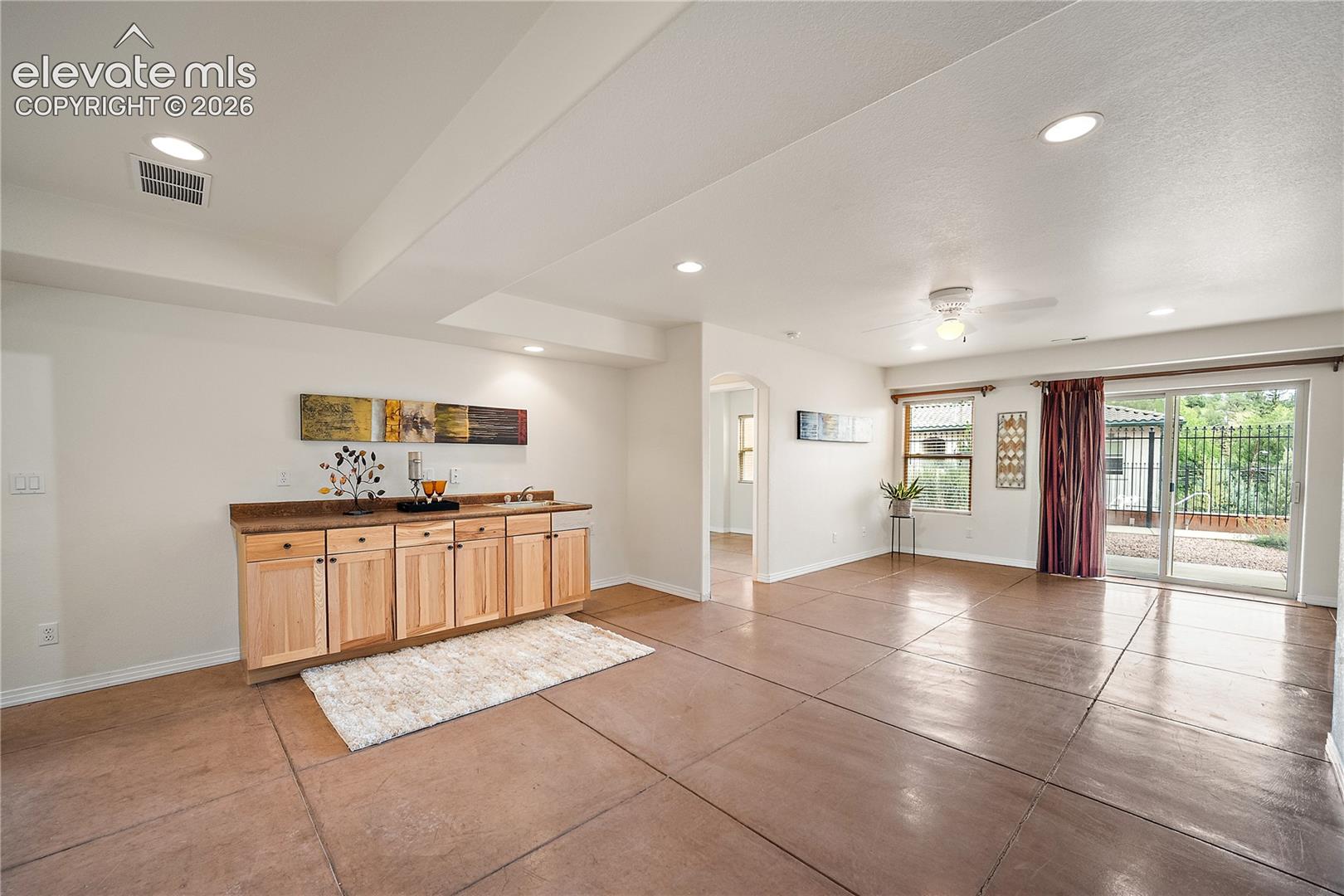 Basement family room with wet bar and walks out. 