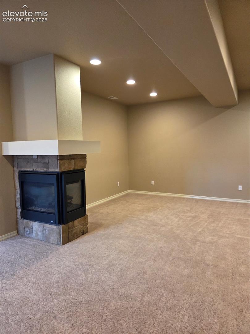 3 sided fireplace in familyroom-entertainment area.