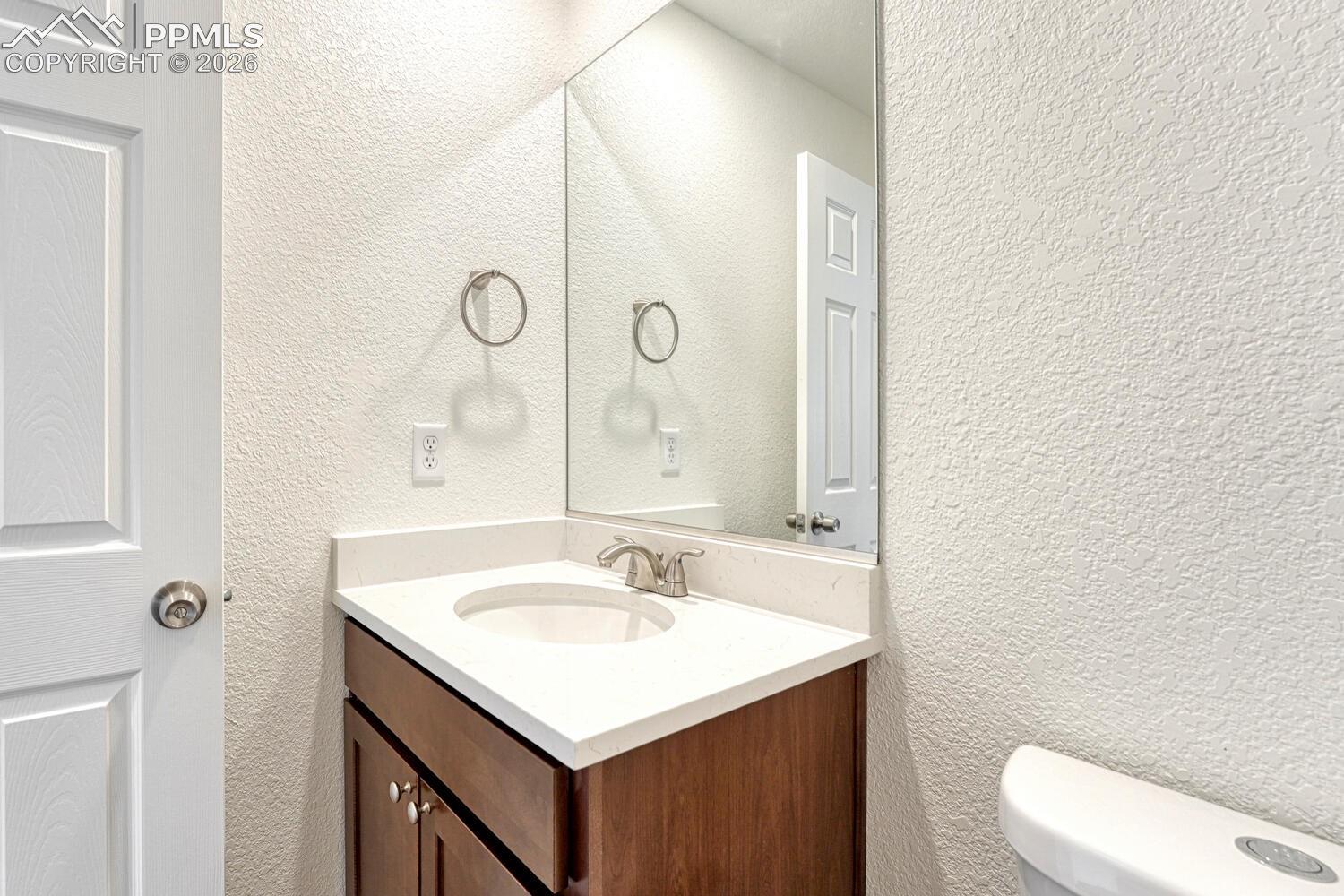 Half bath with your choice of cabinetry and countertop is on the main level. Undermount sink is standard.