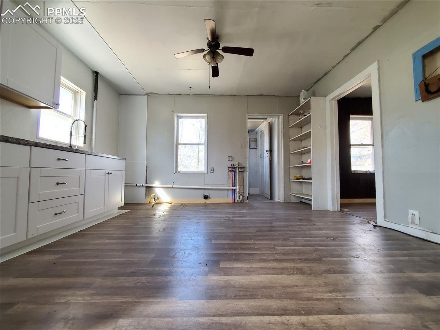 Kitchen with Ceiling Fan (Looking from Living Room Towards Back of House)