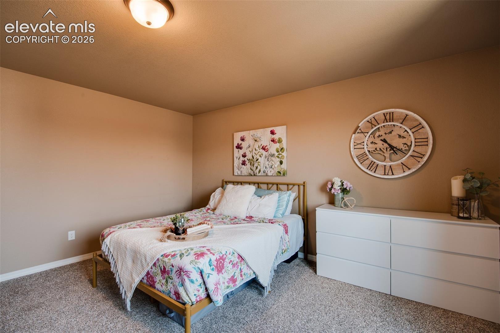 The Primary Bedroom has neutral carpet, a walk in closet, and adjoining 5-Piece Bathroom.