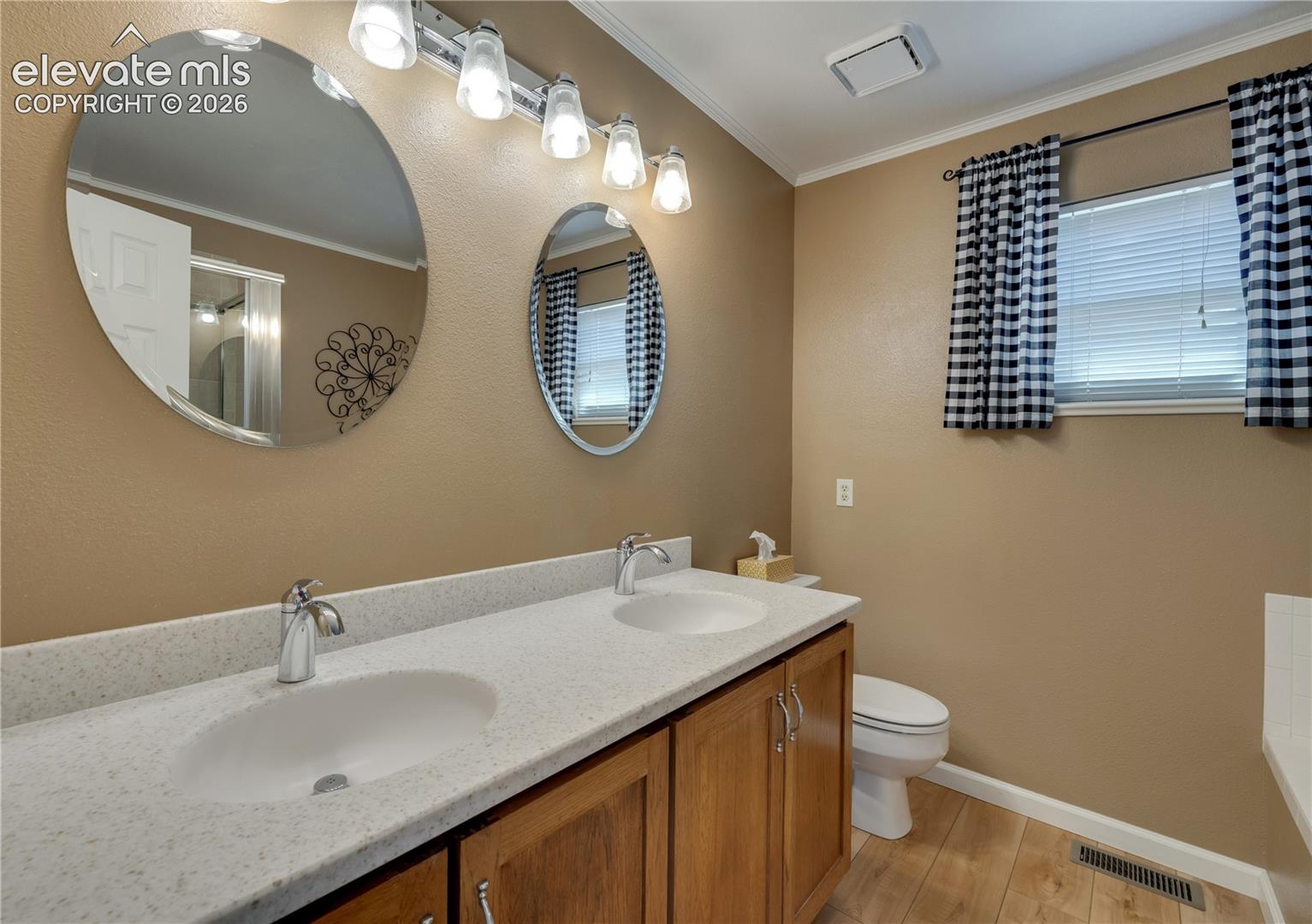 Double sinks in remodeled master bathroom