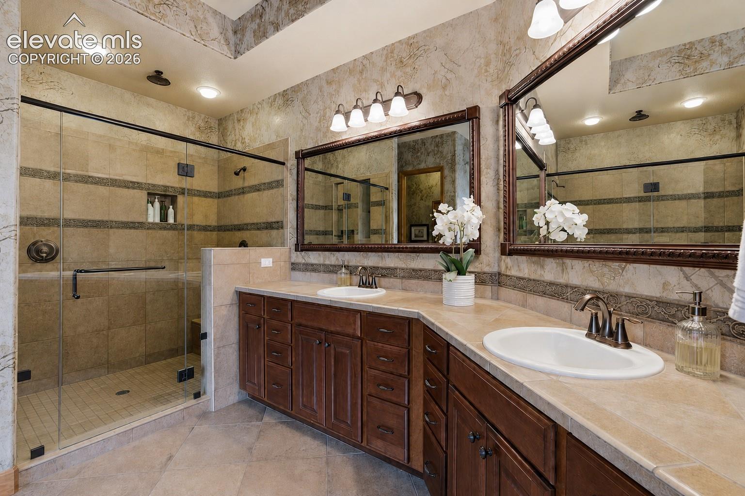 Double Vanity, Glass Shower with Bench and multiple Shower Heads!