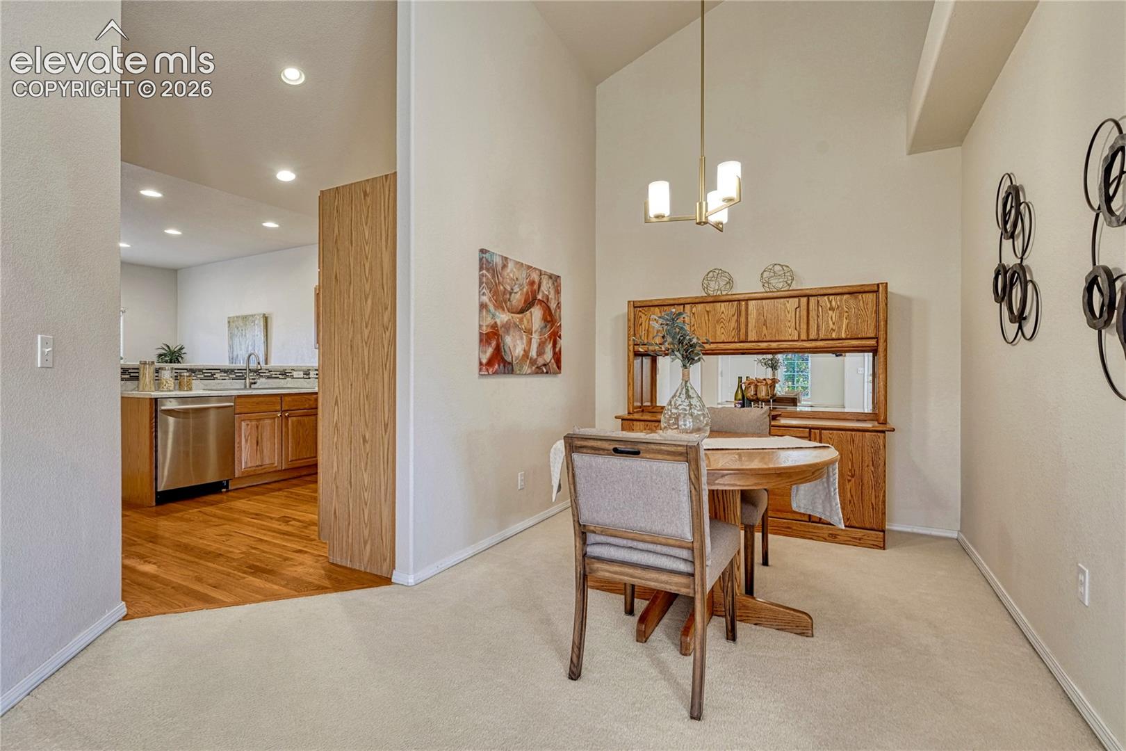 Enjoy formal meals in the dedicated dining space highlighted by a classic chandelier and convenient open access to the kitchen
