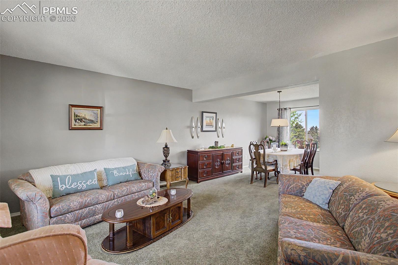 Formal living room, looking through to formal dining.