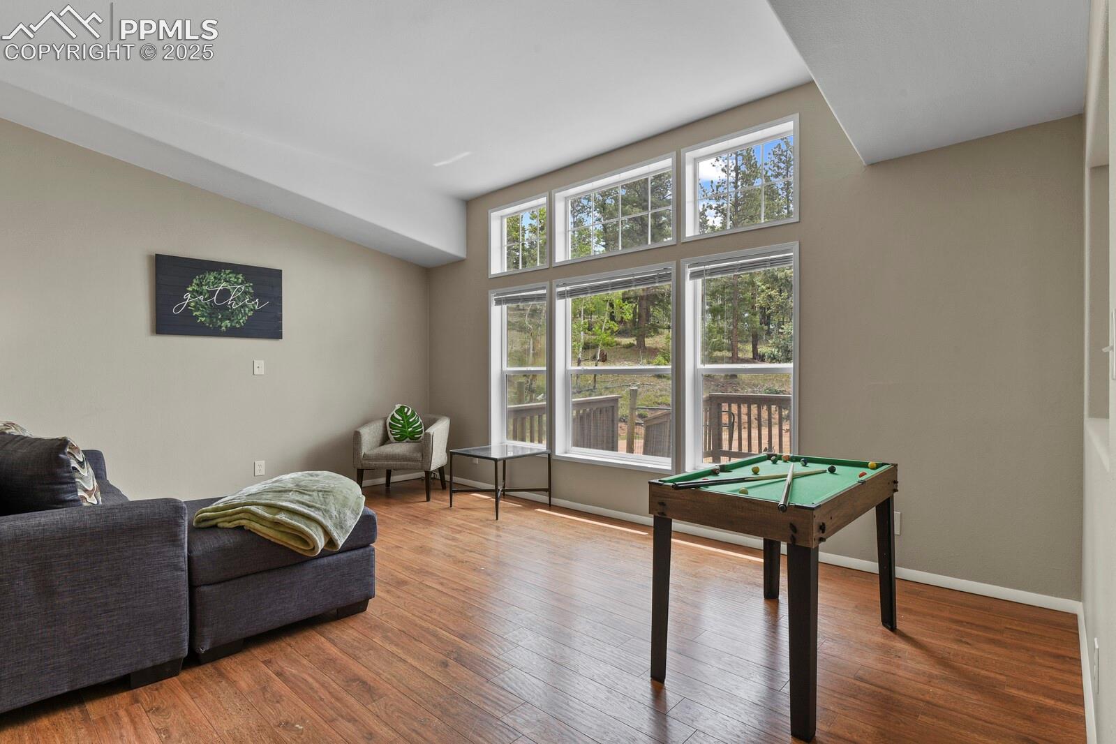 Recreation room featuring pool table and hardwood / wood-style flooring