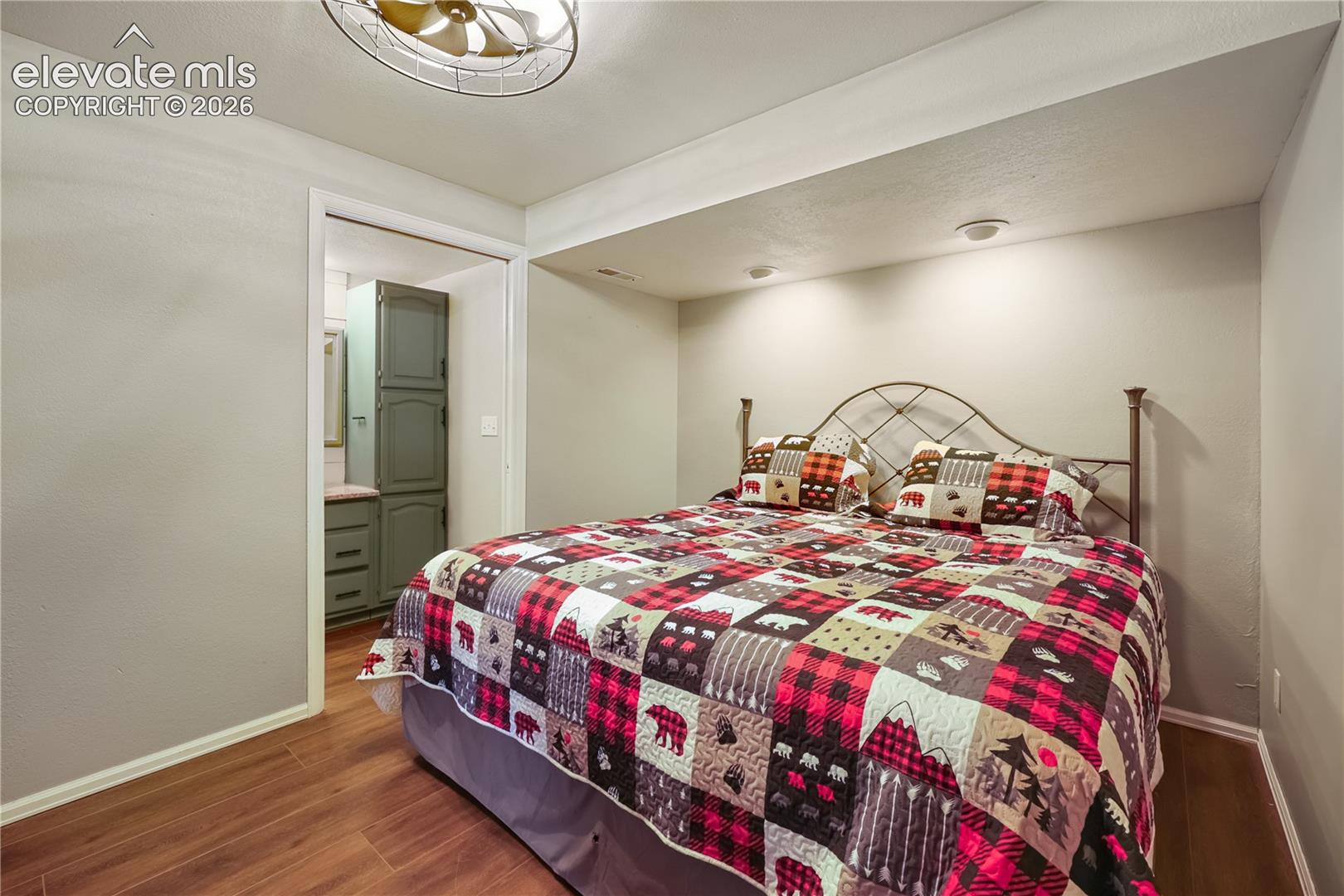 Bedroom in basement with attached bathroom.