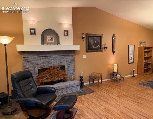 Wood fireplace, vaulted ceilings open to dining area and back enclosed sunroom