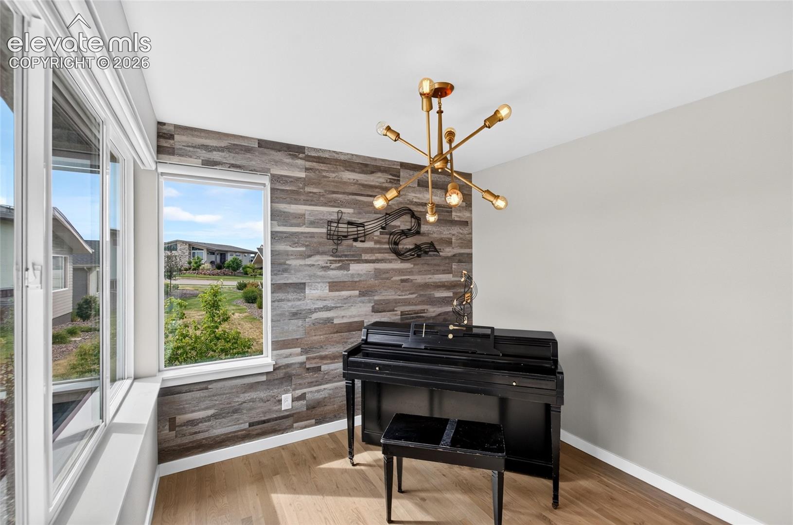 Expansive window wall with multiple panes and a central window- many potential uses for this room