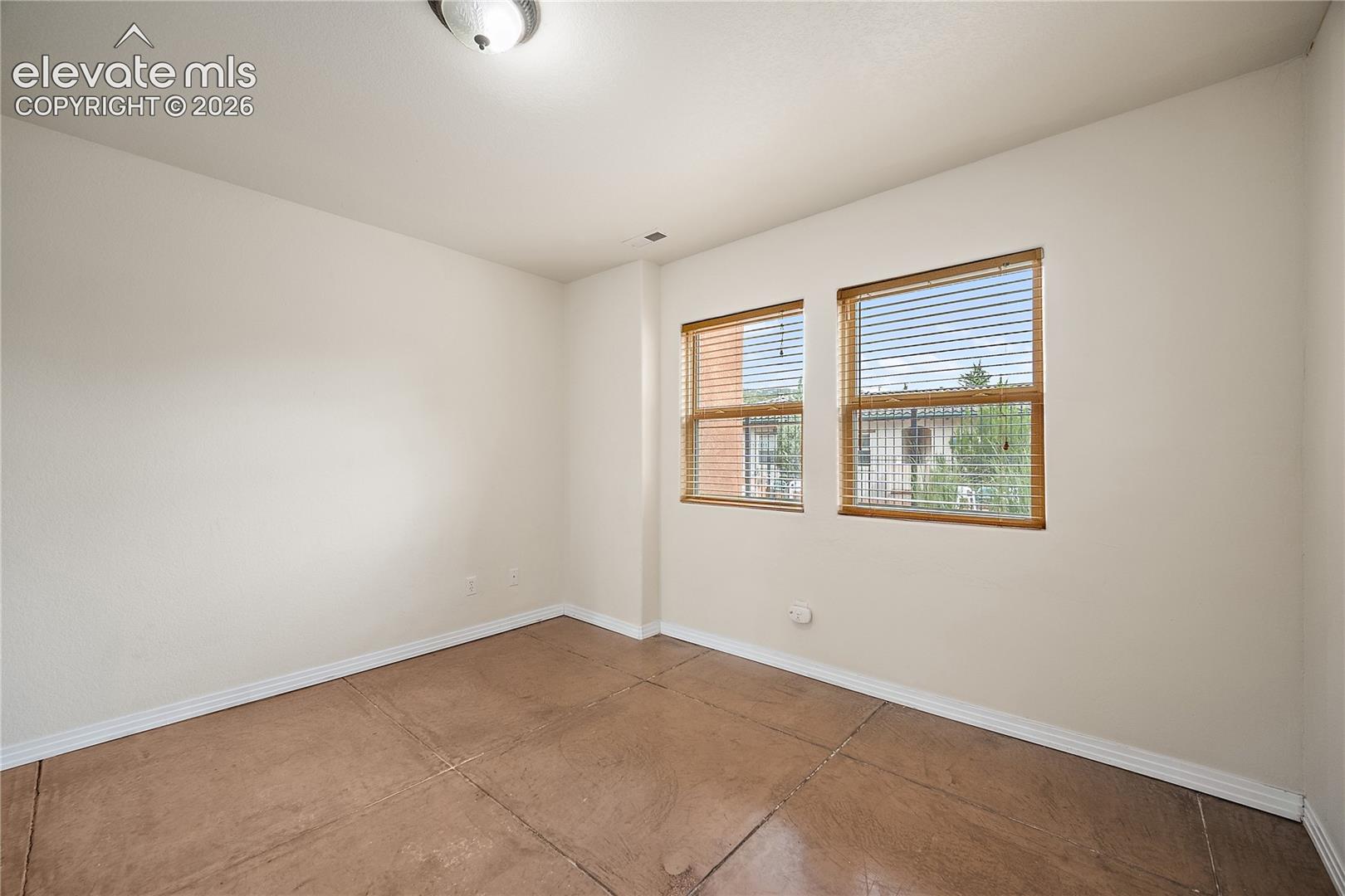 Basement bedroom with walk in closet and pool view. 