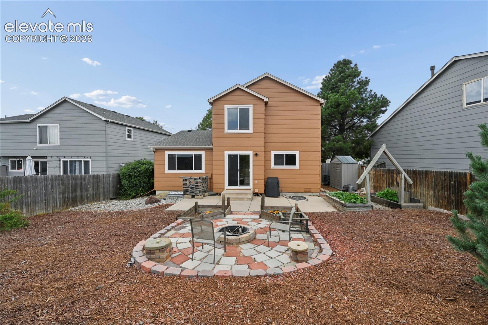 Firepit patio and raised garden beds