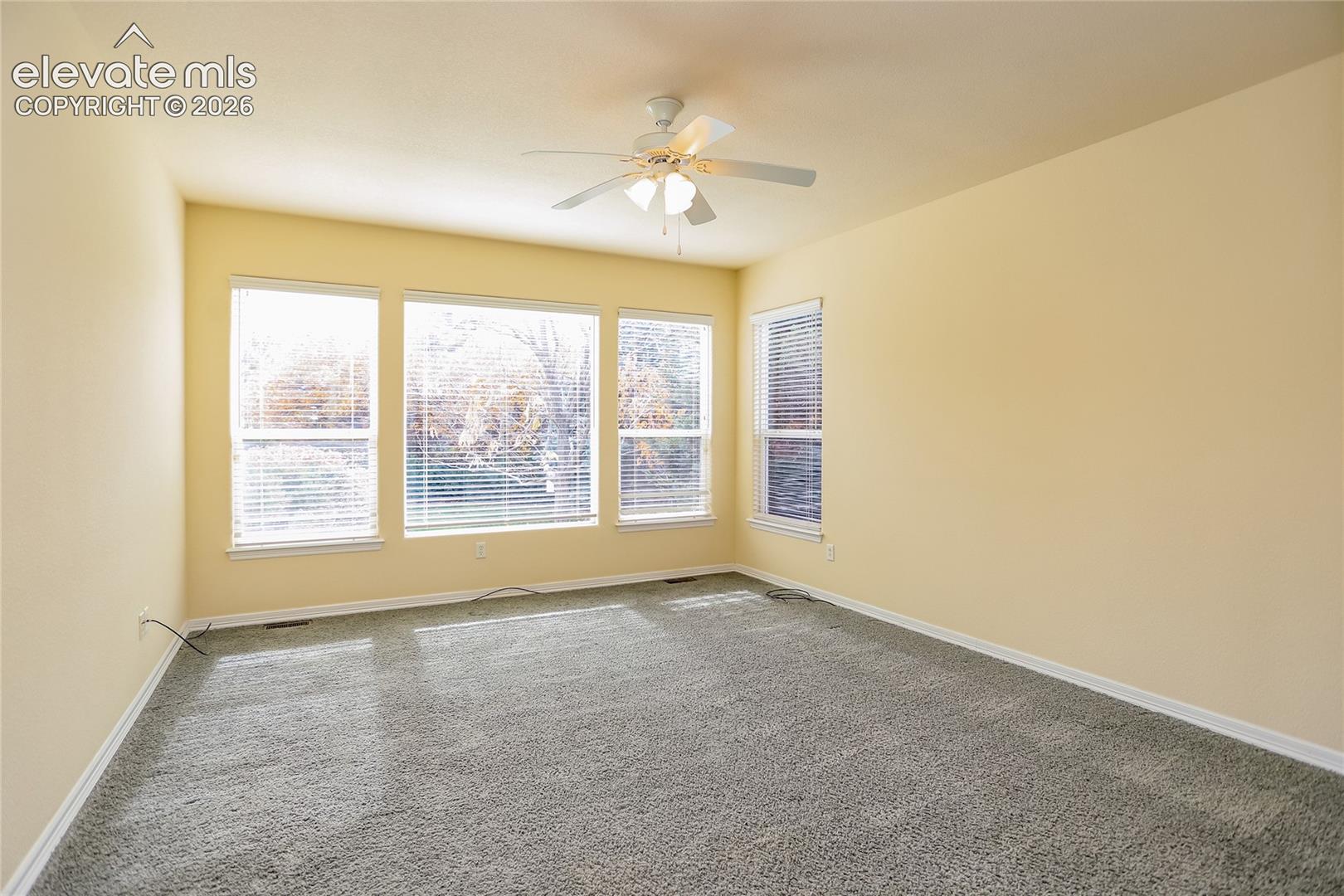 Primary suite is located on the main level and has large windows bringing the outdoors in!