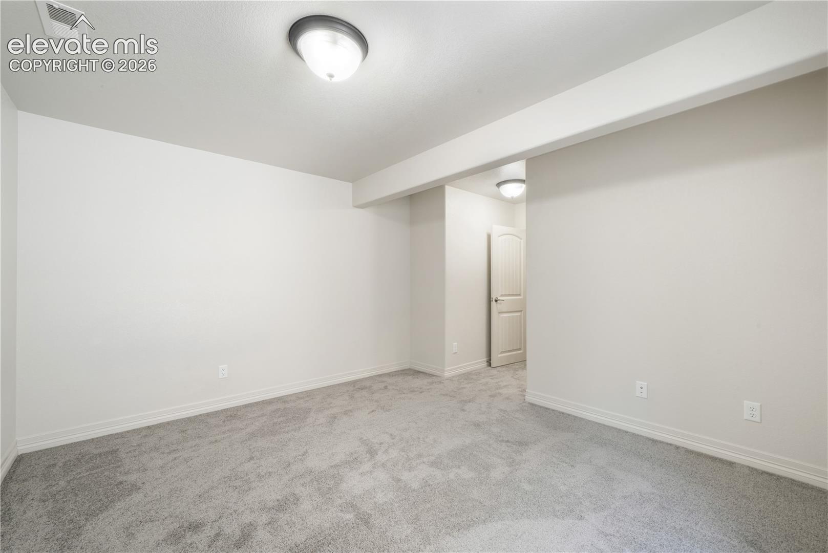 Basement 4th bedroom with large walk in closet and new carpet