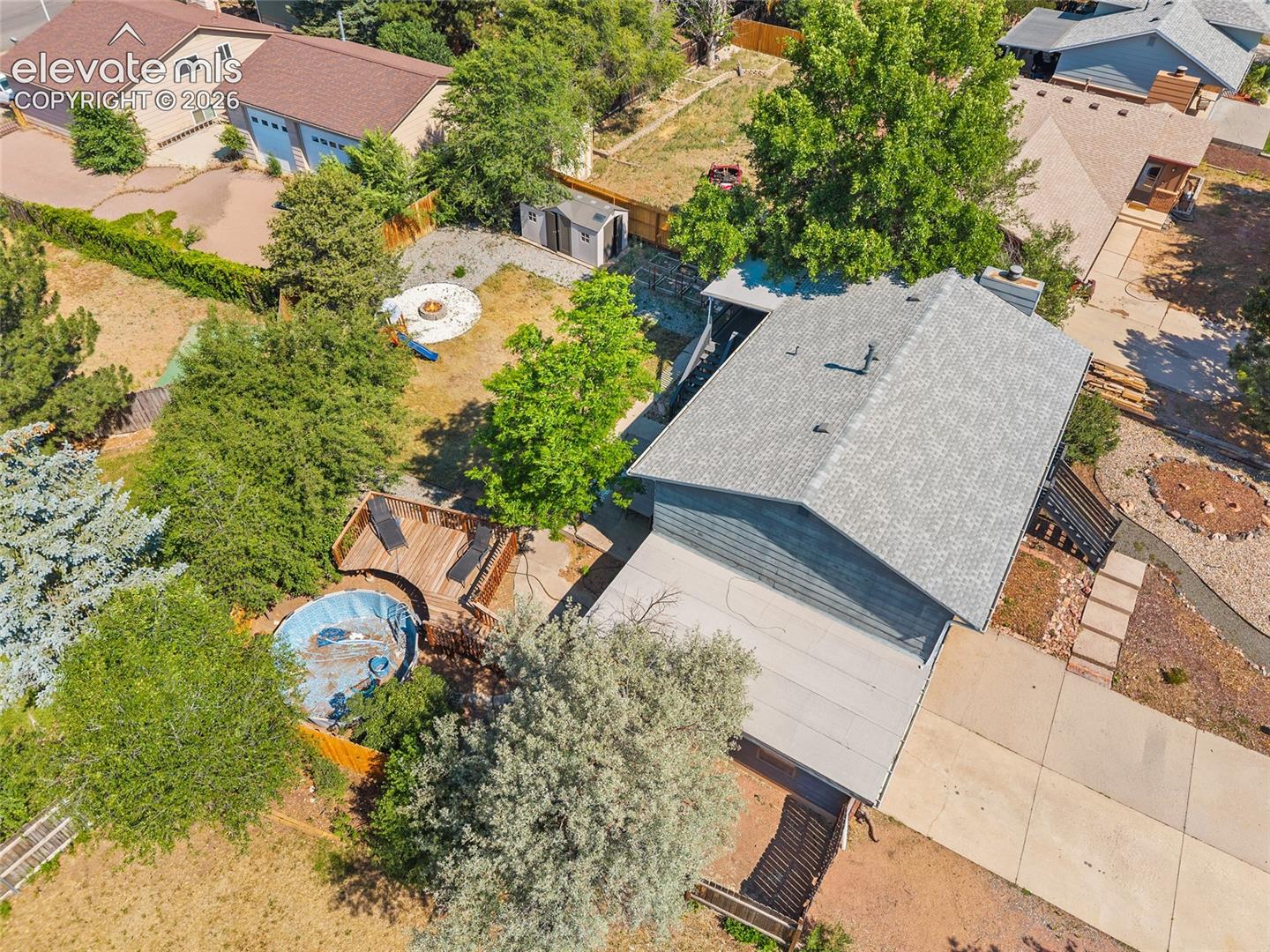 Aerial view showing mature trees.