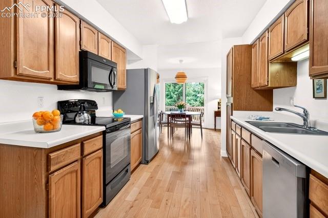 Kitchen designed with plenty of cabinets for organization and convenience along with a spacious pantry with custom pull out drawers.