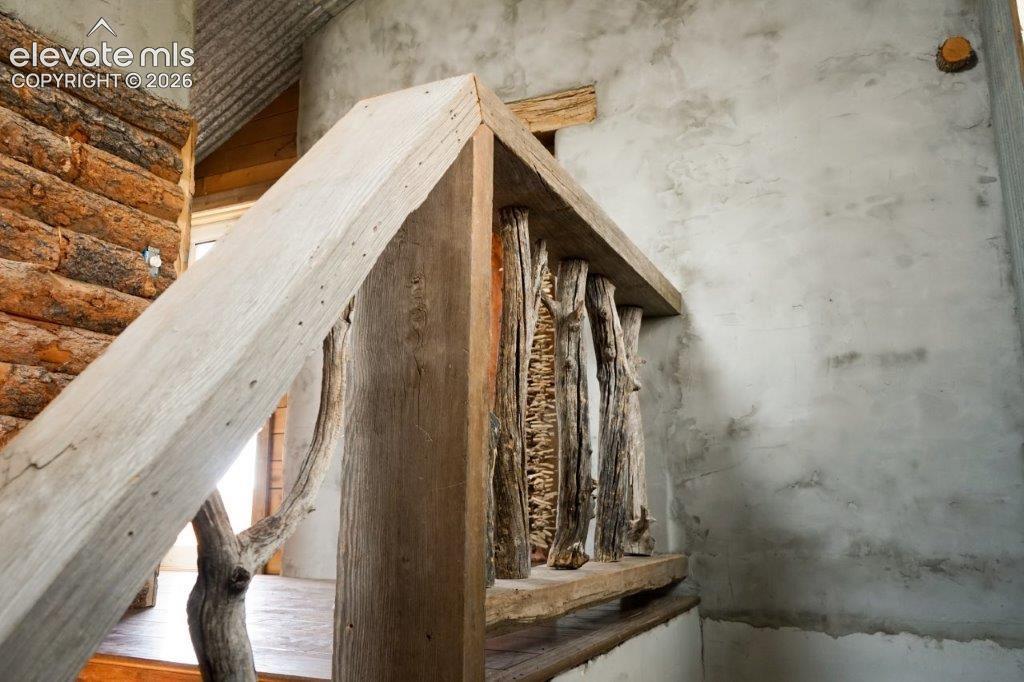 Rustic wood railing with natural branch spindles