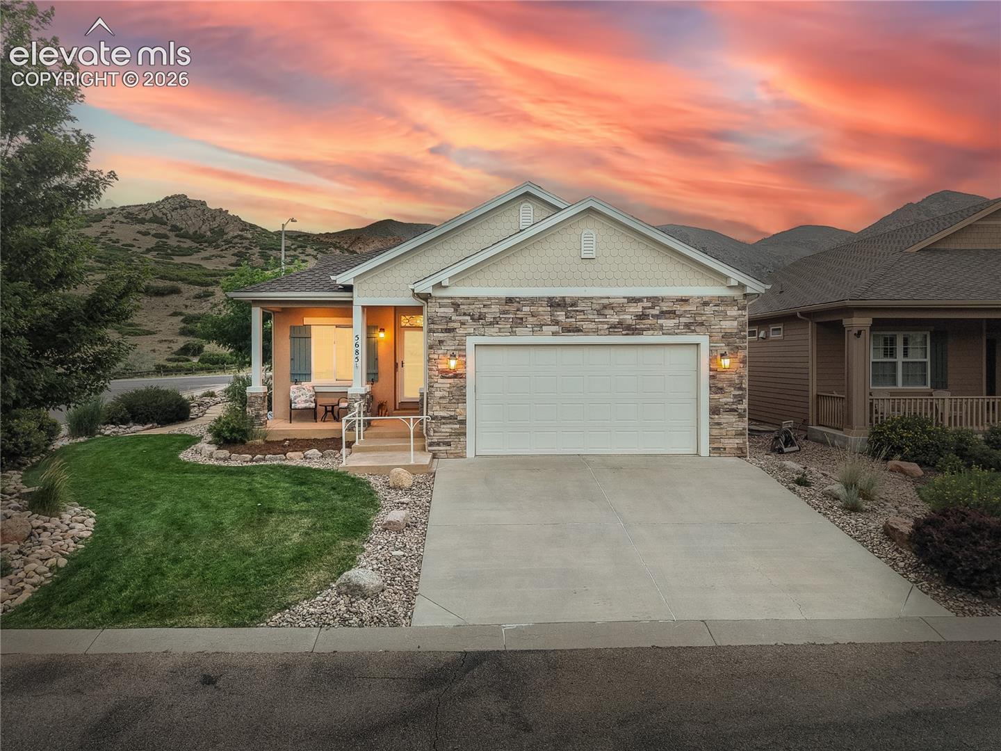 Welcome to easy main-level living in sought-after Parkside at Mountain Shadows, where stunning mountain views, low-maintenance living, and an exceptional outdoor setting come together. Situated on a quiet corner cul-de-sac lot, this impeccably maintained ranch offers easy access to hiking trails, parks, shopping, dining, and some of the best walking routes on Colorado Springs' west side. The HOA covers lawn care, snow removal, trash service, and more, creating the perfect lock-and-leave lifestyle. Inside, rich hardwood floors, 9-foot ceilings, crown molding, and abundant natural light create a warm, inviting atmosphere. The great room features a cozy gas fireplace and walks out to the backyard, while the gourmet kitchen offers granite countertops, white cabinetry, stainless steel appliances, a gas range, pantry, breakfast bar, and sunny dining area with patio access. The spacious primary suite includes a sitting area, custom walk-in closet, and spa-like bath with double vanity and oversized shower. Main-level laundry and a powder bath complete the main floor. The finished basement offers a large family room with a second gas fireplace, wet bar, and built-ins, plus two spacious bedrooms and a full bath, ideal for guests, entertaining, or movie nights. The backyard is the showstopper. Relax beneath the covered patio and retractable awning while enjoying the tranquil water feature, paver patio, and breathtaking mountain views. Whether sipping morning coffee or hosting friends, this outdoor living space is sure to become your favorite retreat. Additional highlights include a smart thermostat, smart garage door opener, Sonos sound system, security system, humidifier, radon mitigation system, central air, auto sprinkler system, and an oversized two-car garage. Move-in ready and beautifully maintained, this charming westside home offers comfort, convenience, smart technology, and spectacular Colorado scenery in one of the area's most desirable neighborhoods.